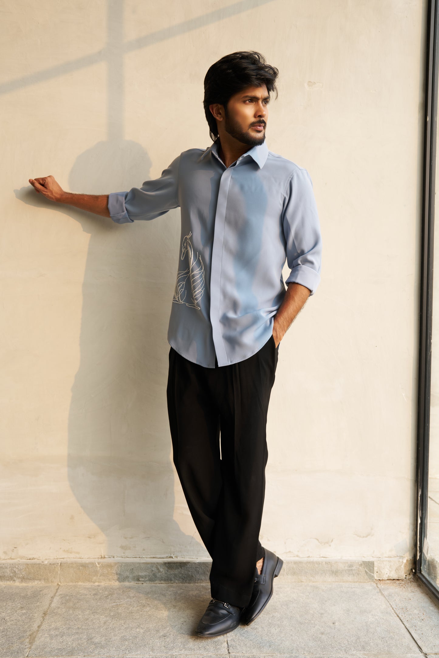 Light grey shirt with a white swan hand embroidery design