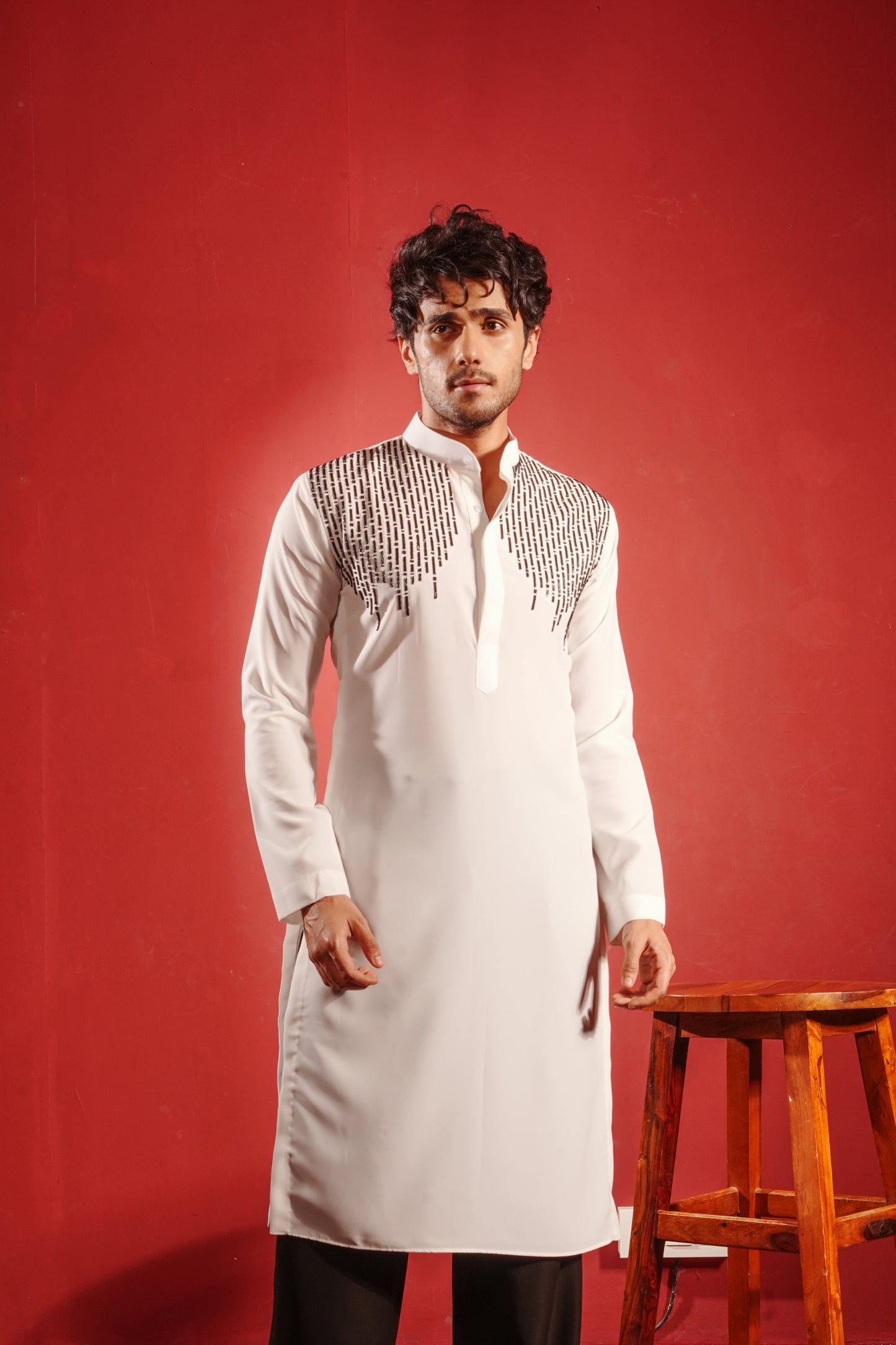 White Kurta Embezzled with Black Motifs Design