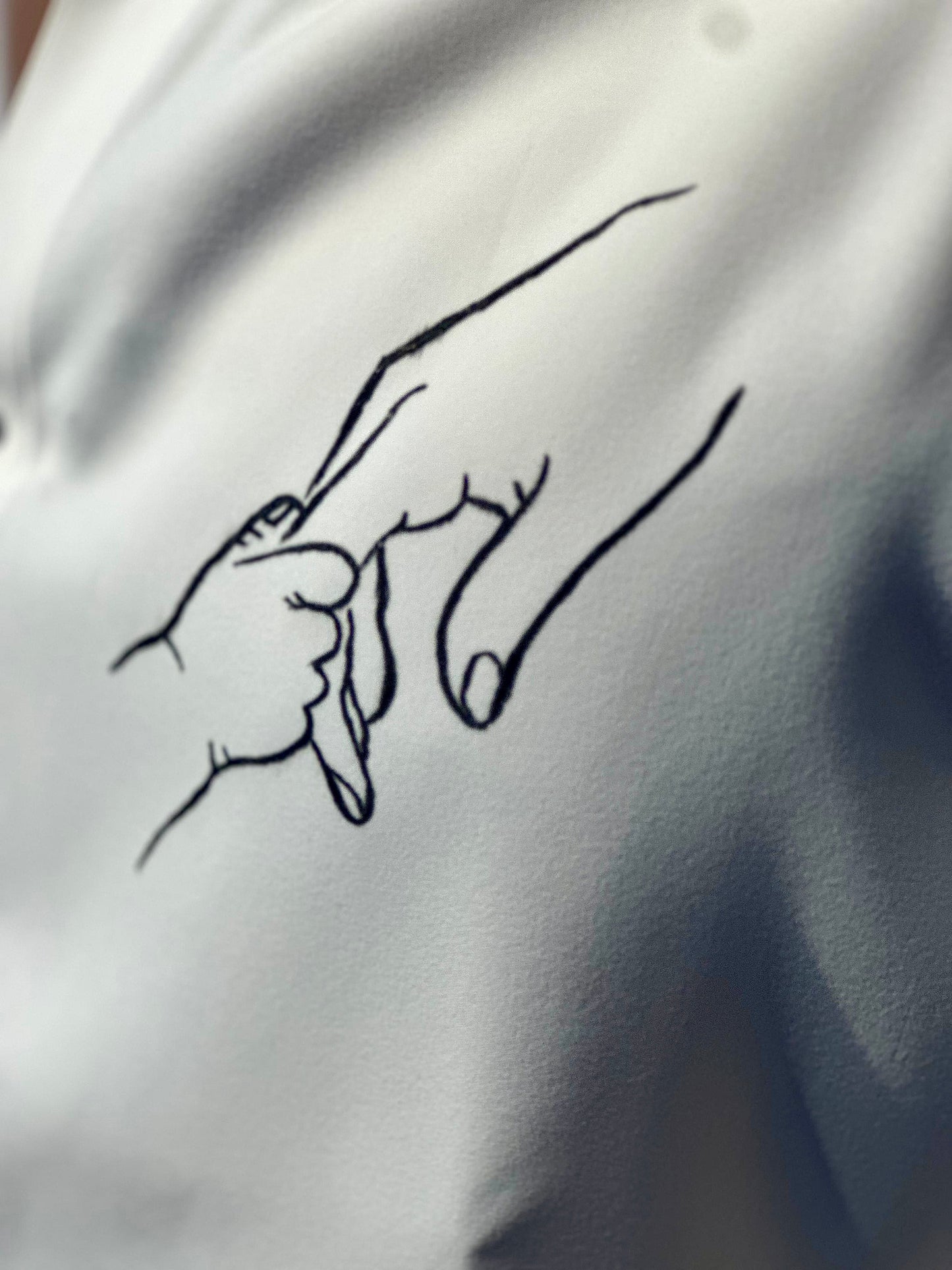 Father-Child holding hands- white shirt