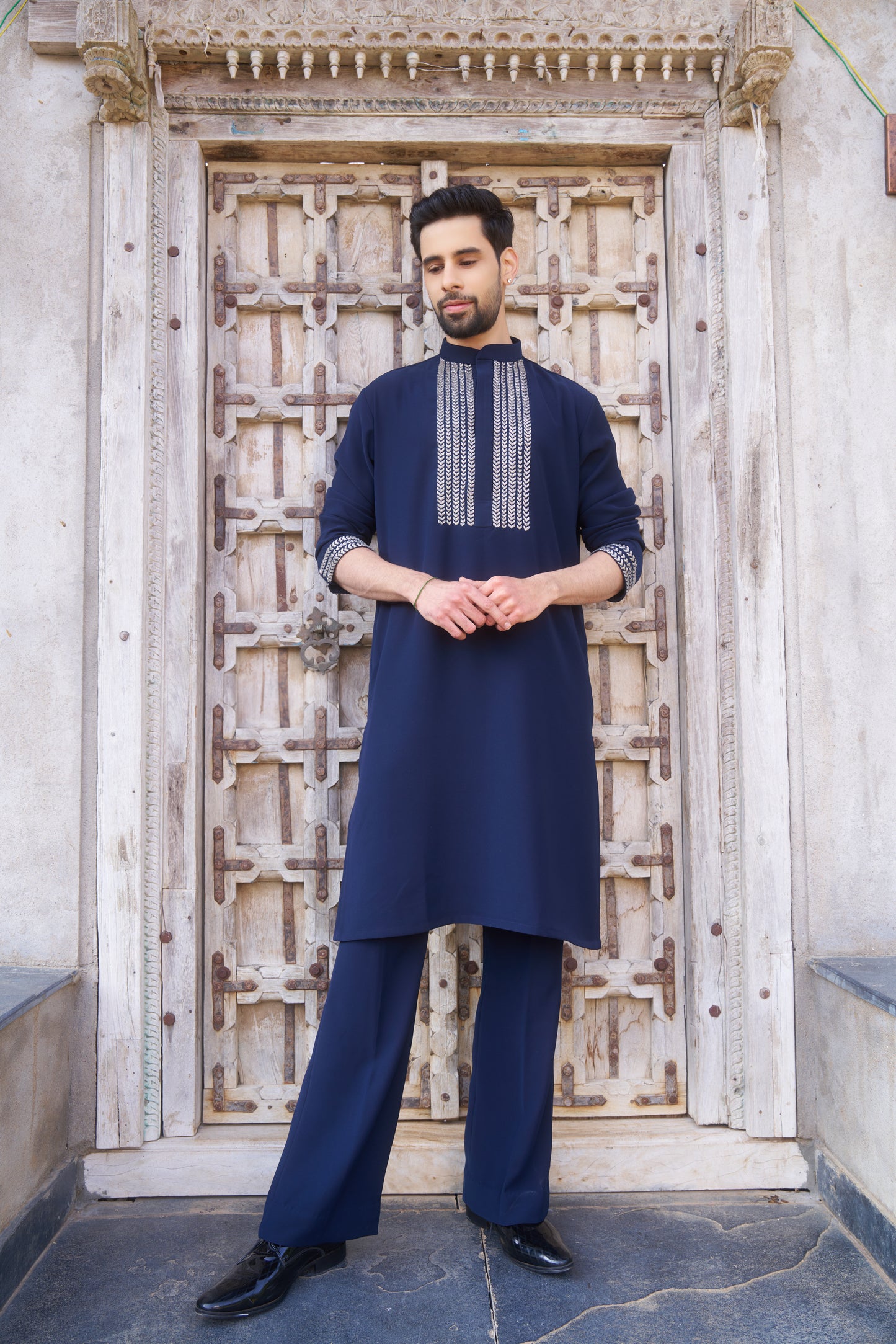 Blue kurta with white intricate hand embroidery design