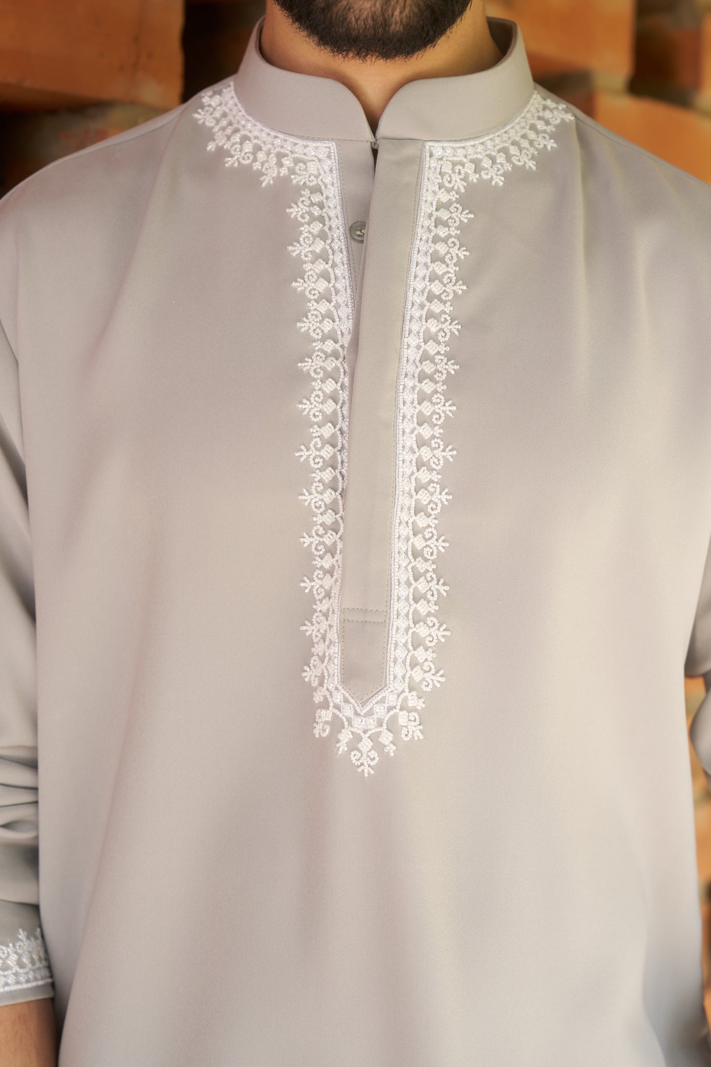 Light green kurtha with white hand embroidery design