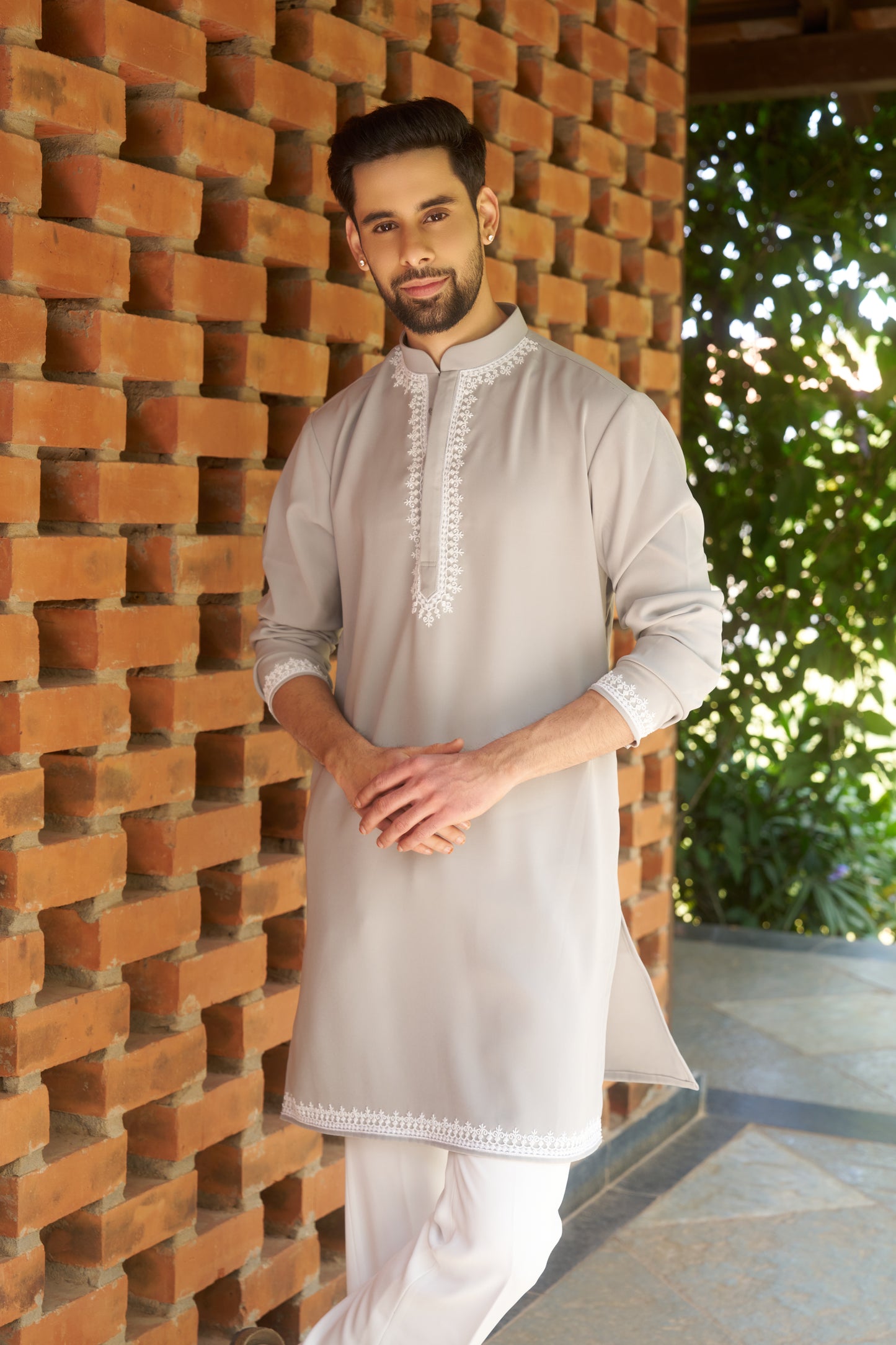Light green kurtha with white hand embroidery design