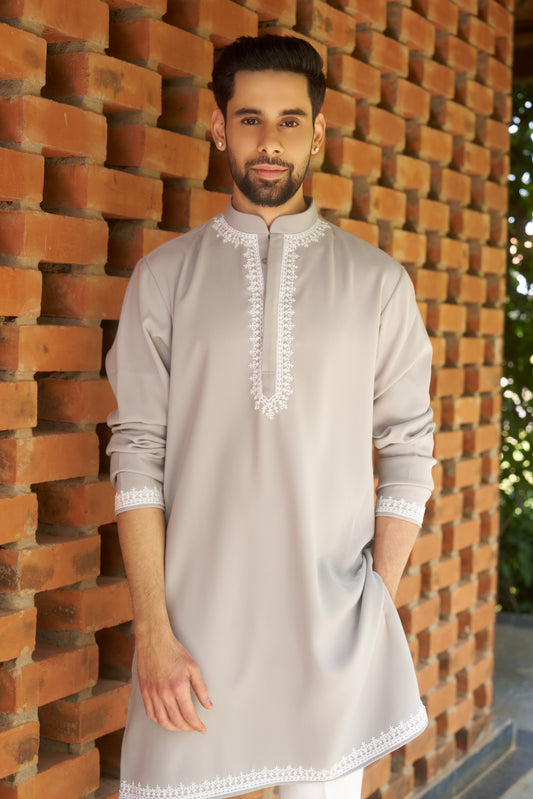 Light green kurtha with white hand embroidery design