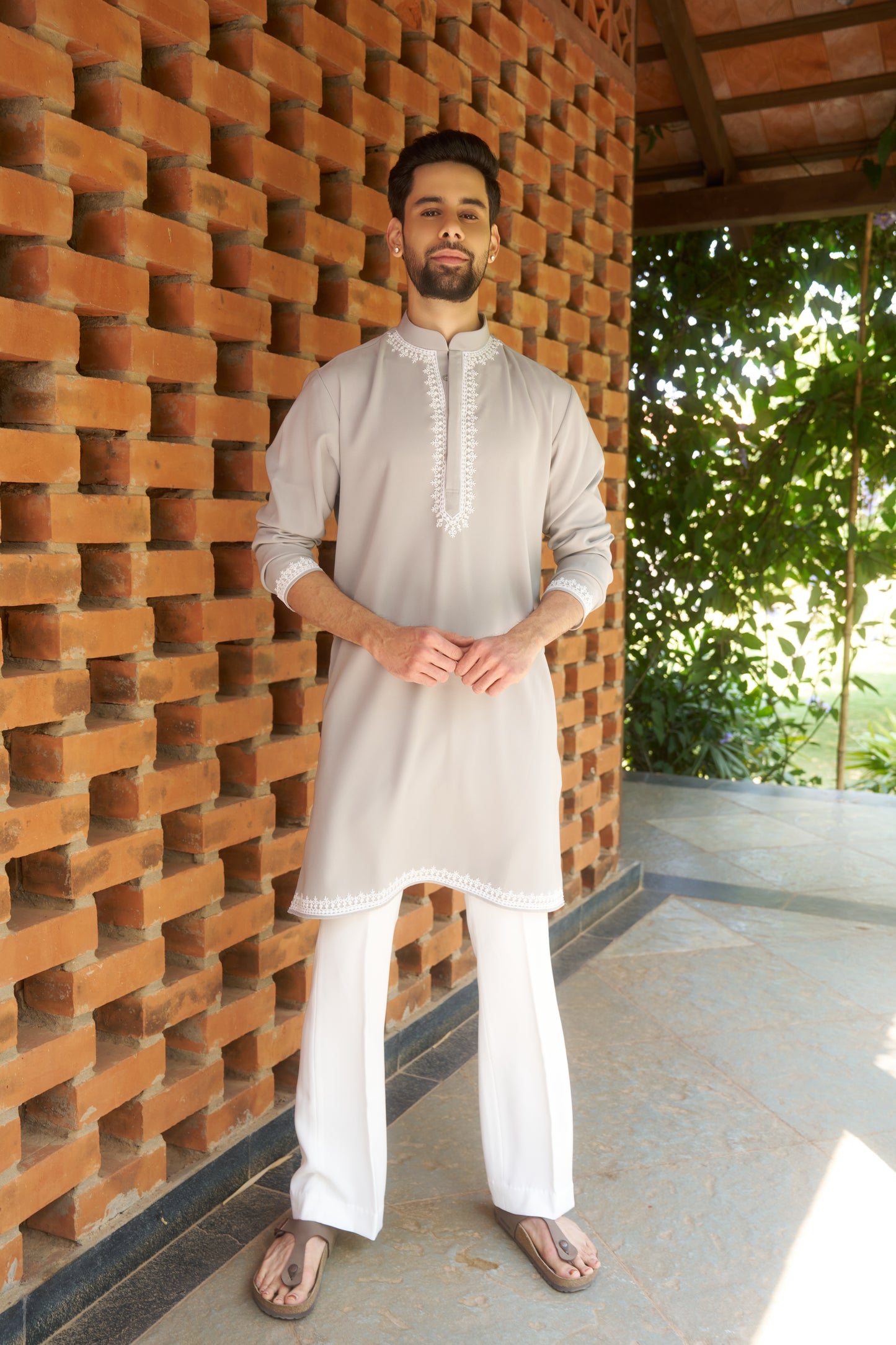 Light green kurtha with white hand embroidery design