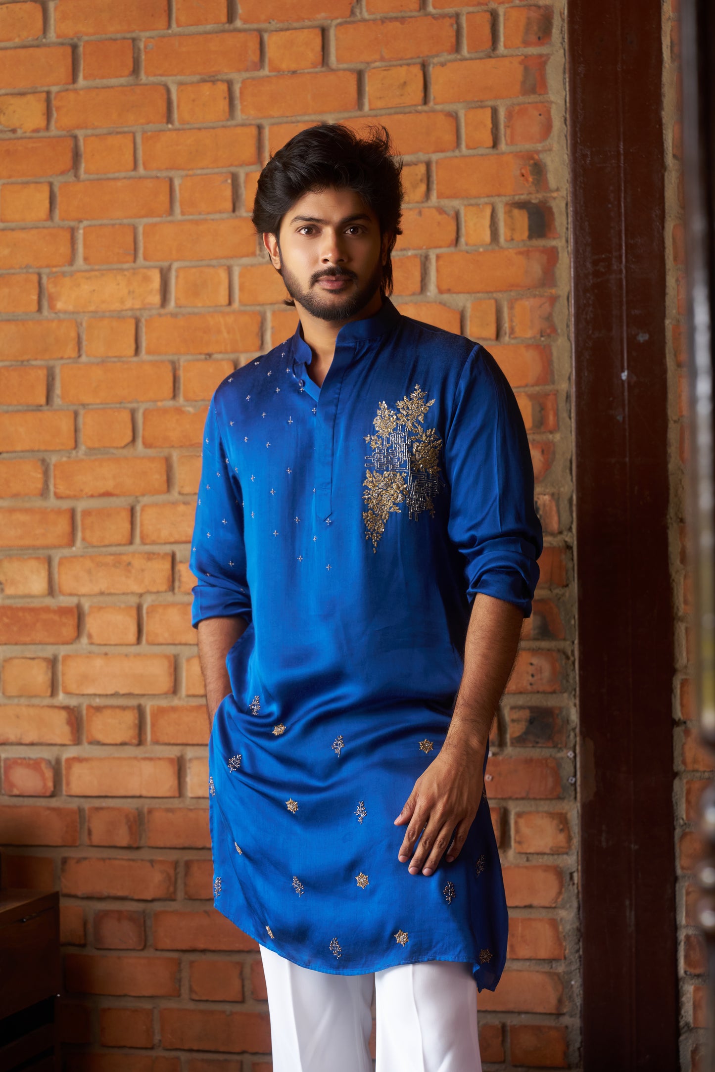 Blue traditional kurta with intricate gold embroidery design