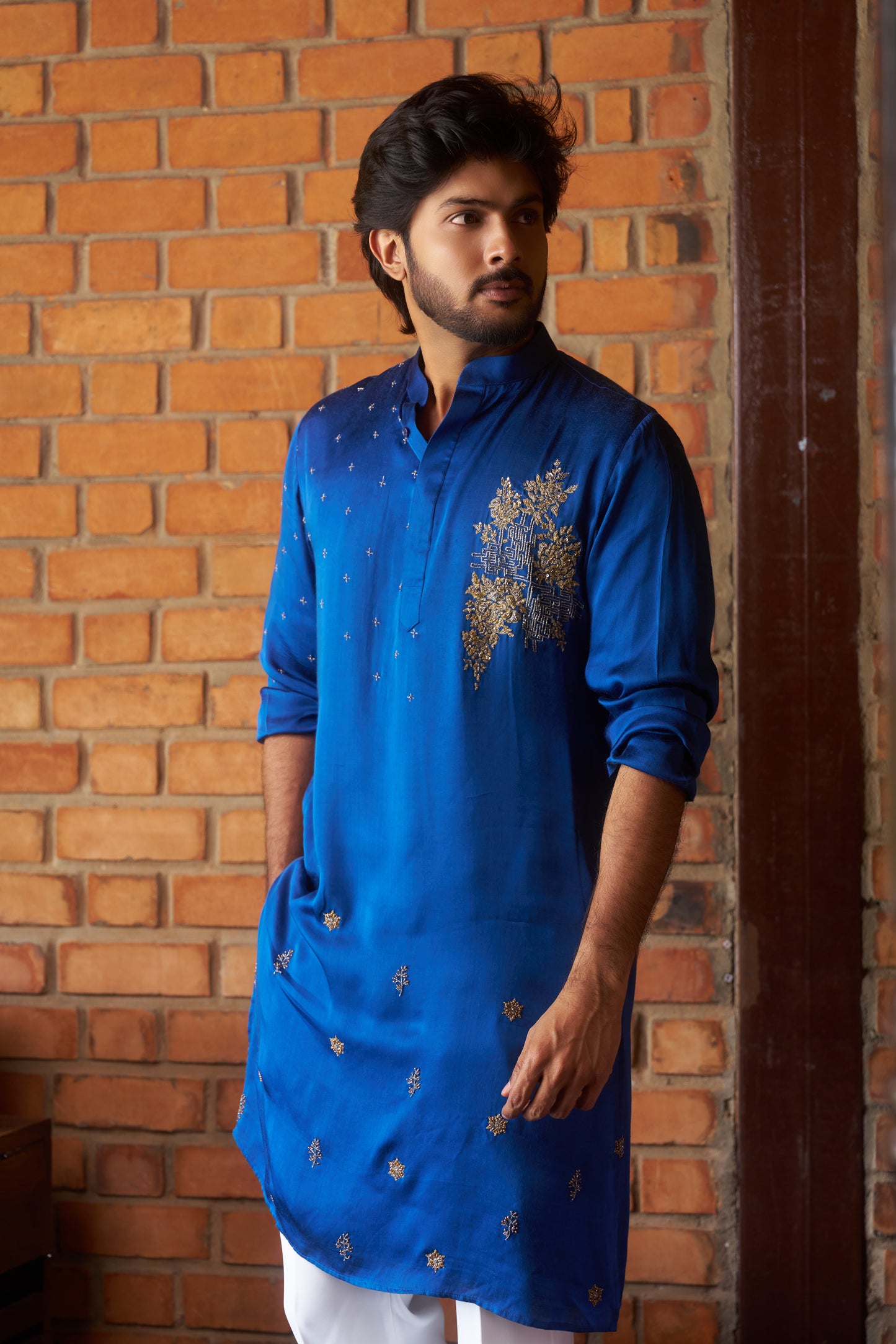 Blue traditional kurta with intricate gold embroidery design