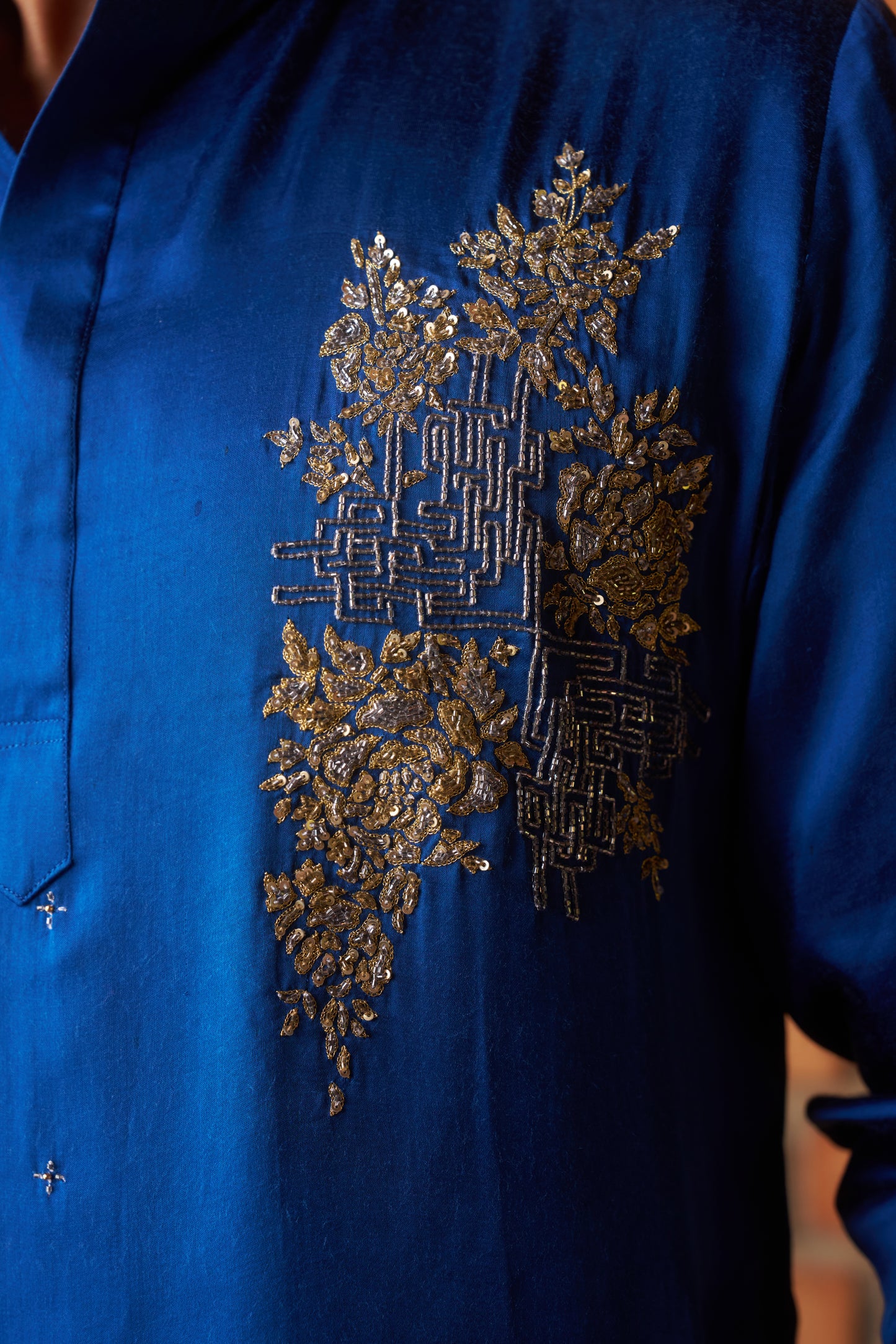 Blue traditional kurta with intricate gold embroidery design