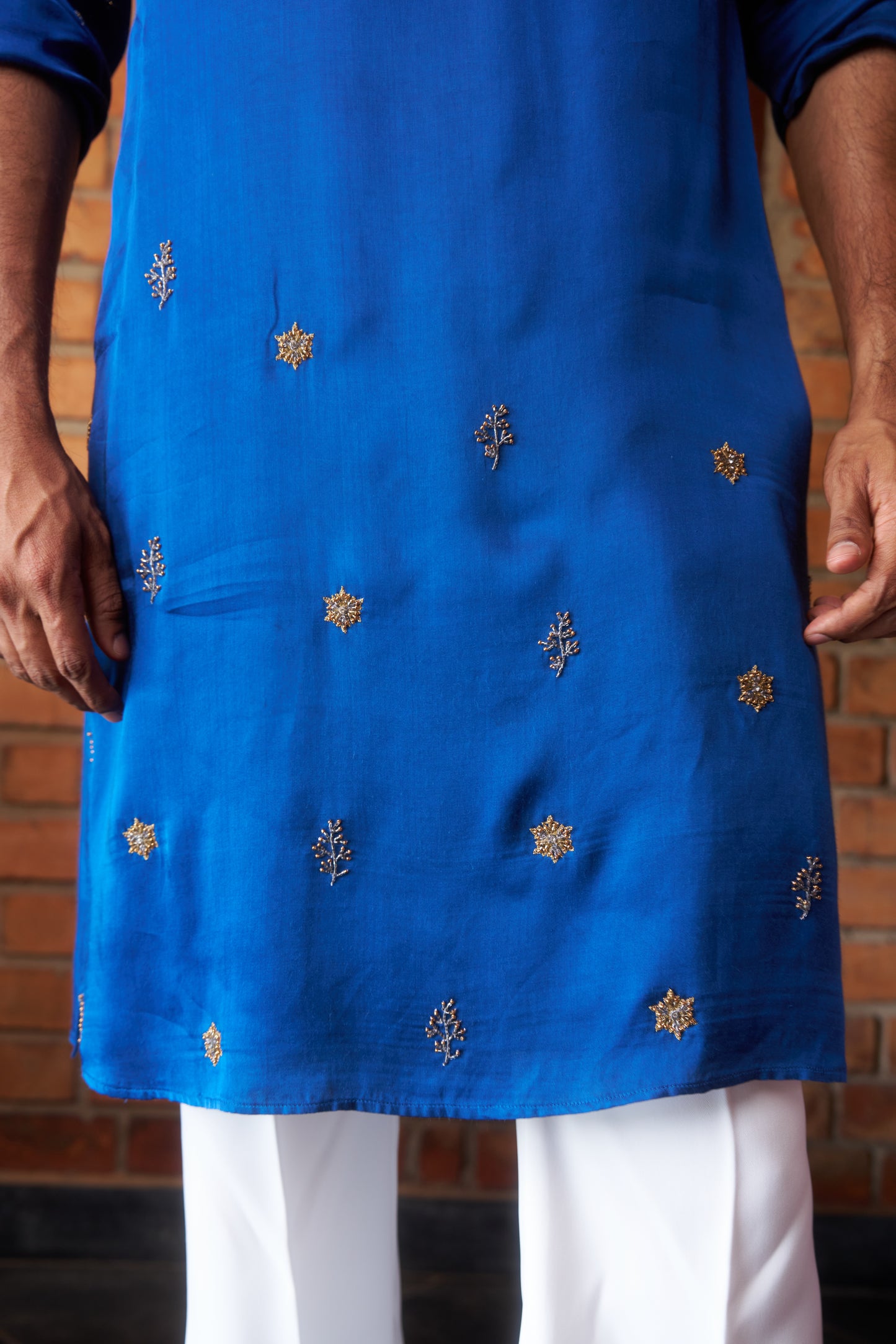 Blue traditional kurta with intricate gold embroidery design