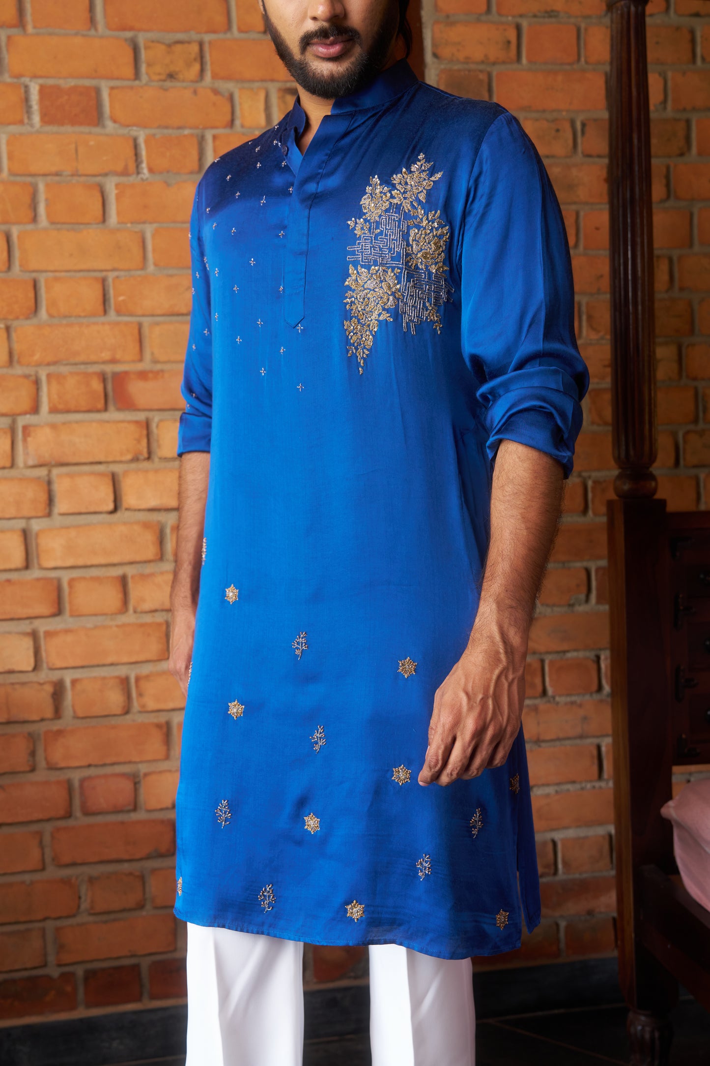 Blue traditional kurta with intricate gold embroidery design