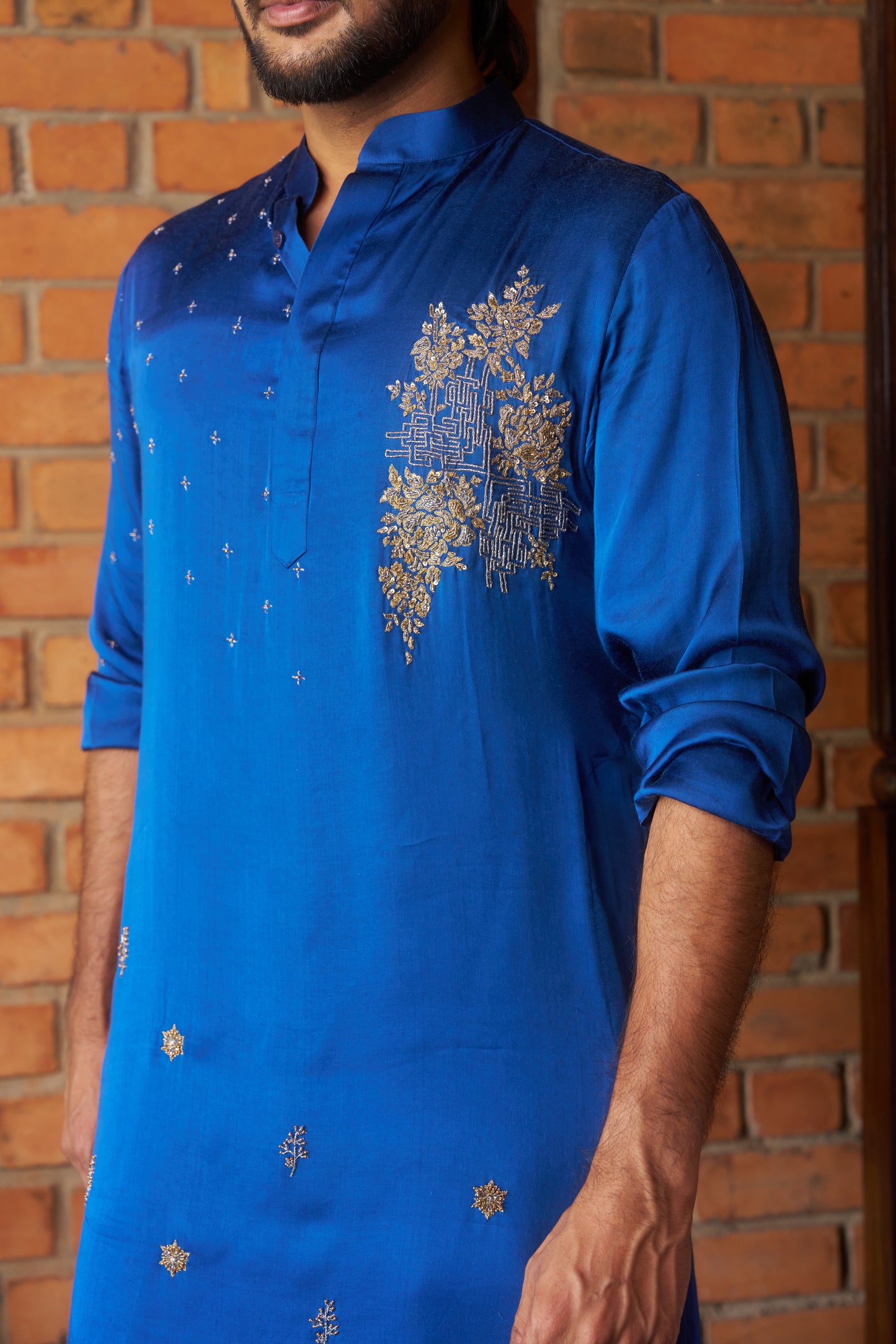 Blue traditional kurta with intricate gold embroidery design