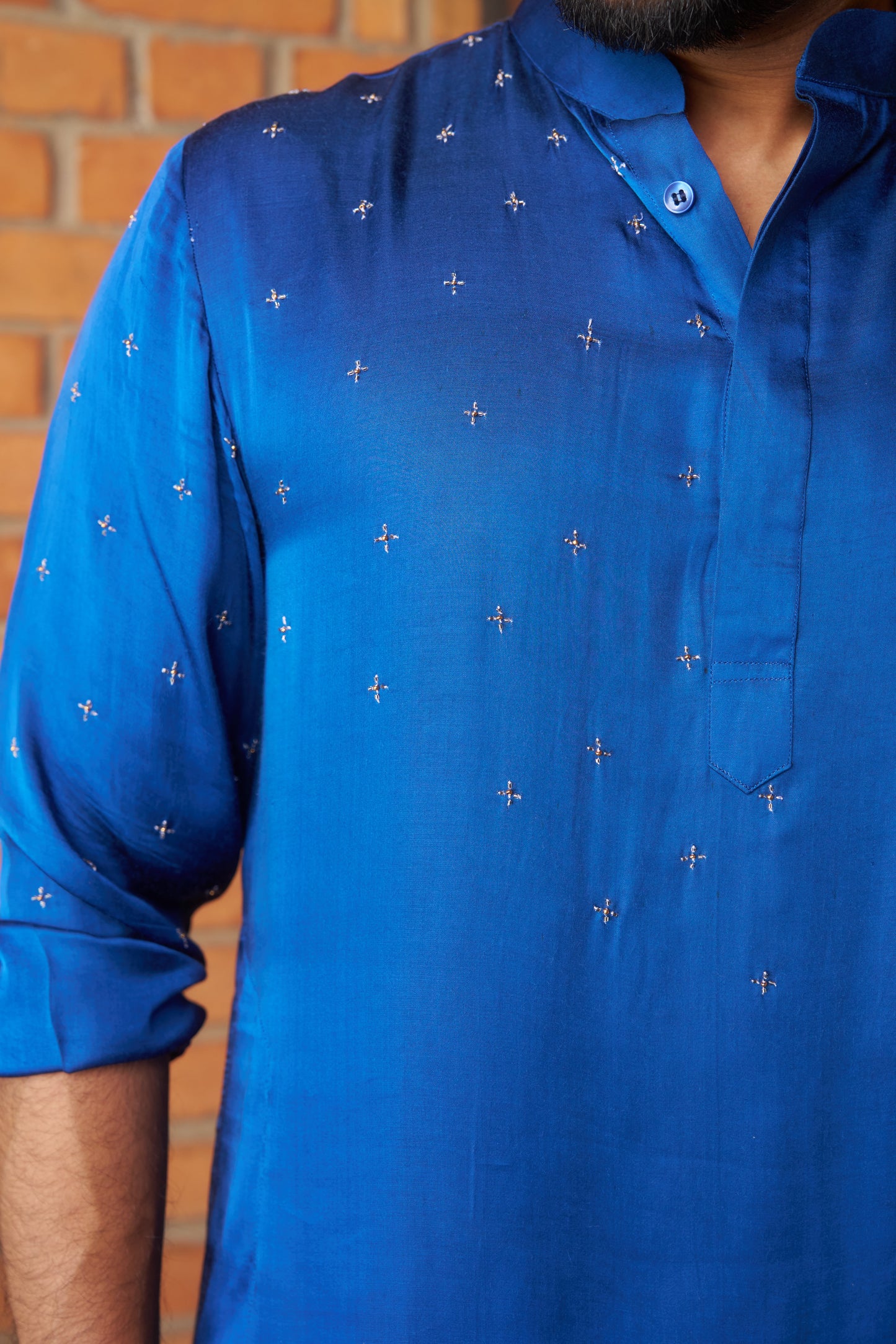 Blue traditional kurta with intricate gold embroidery design