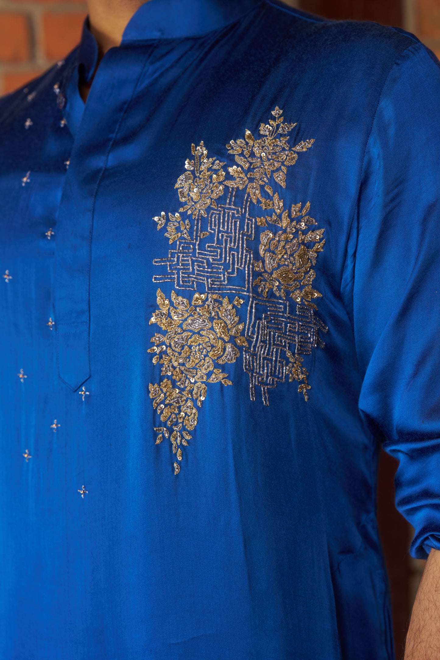 Blue traditional kurta with intricate gold embroidery design