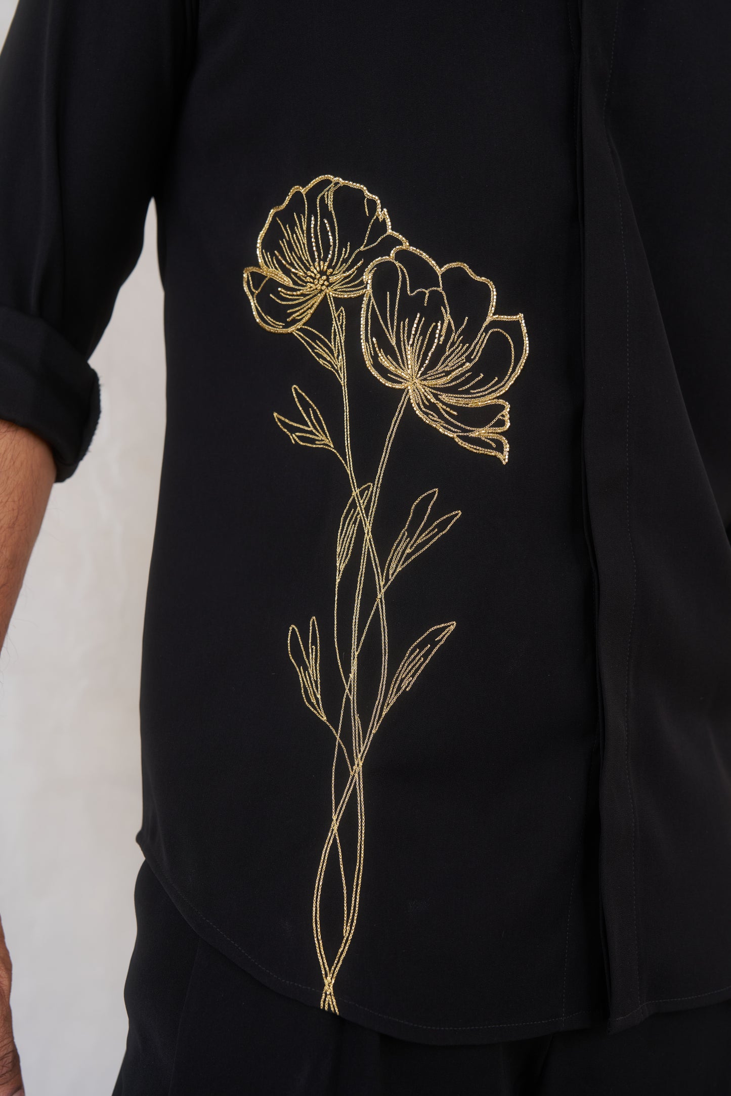 Black shirt with gold floral emrboidery design