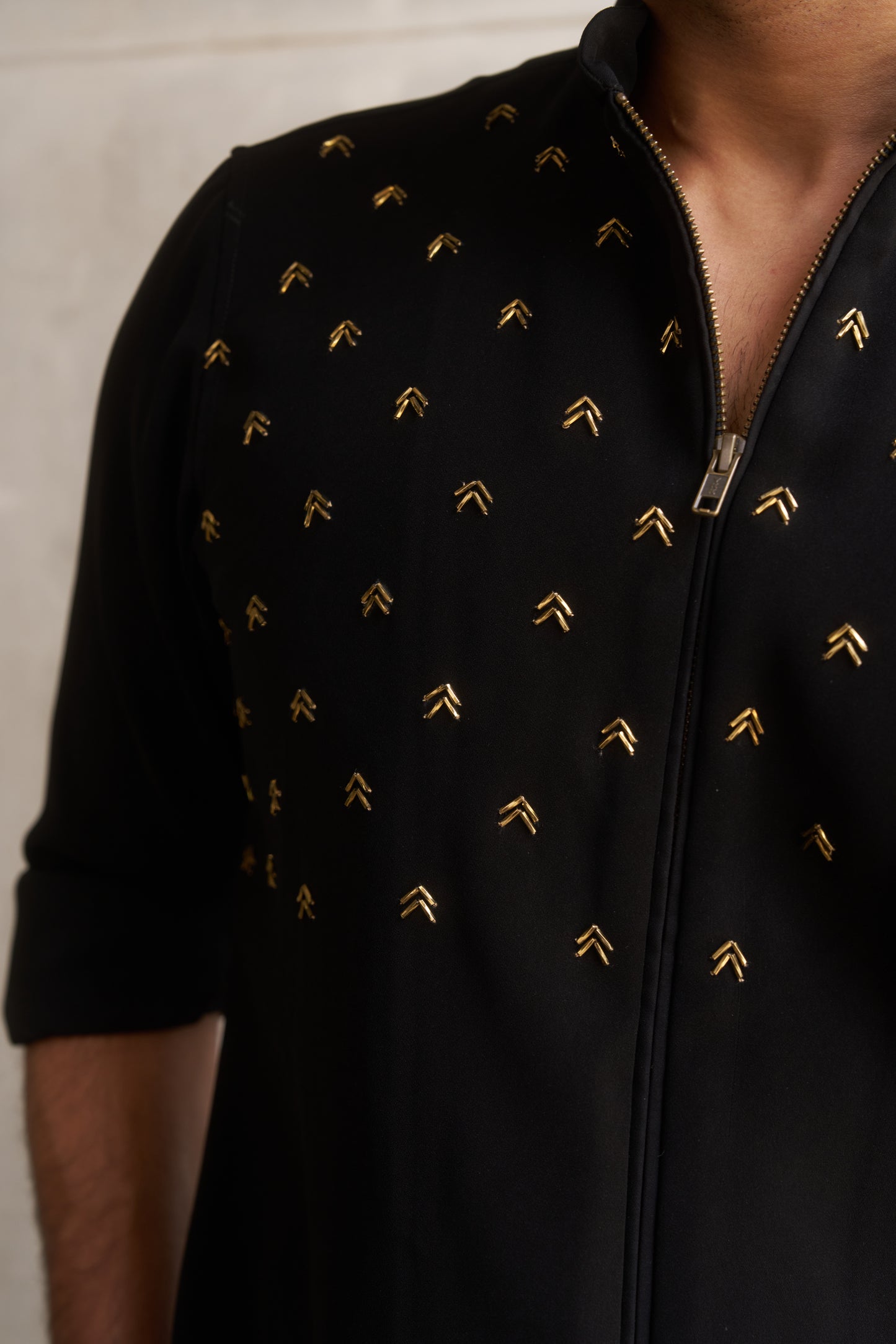 Black zipper shirt with gold arrow design