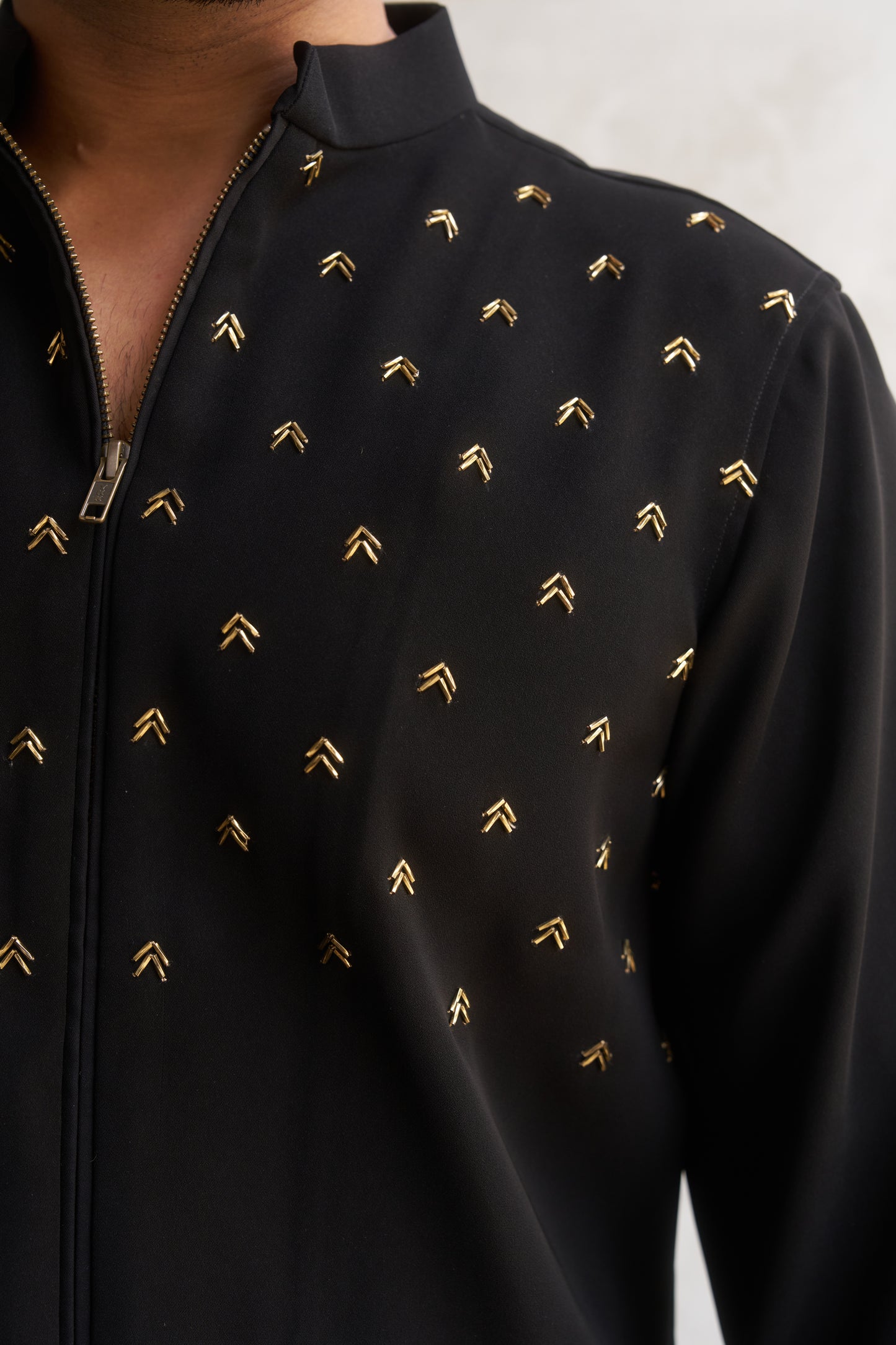 Black zipper shirt with gold arrow design
