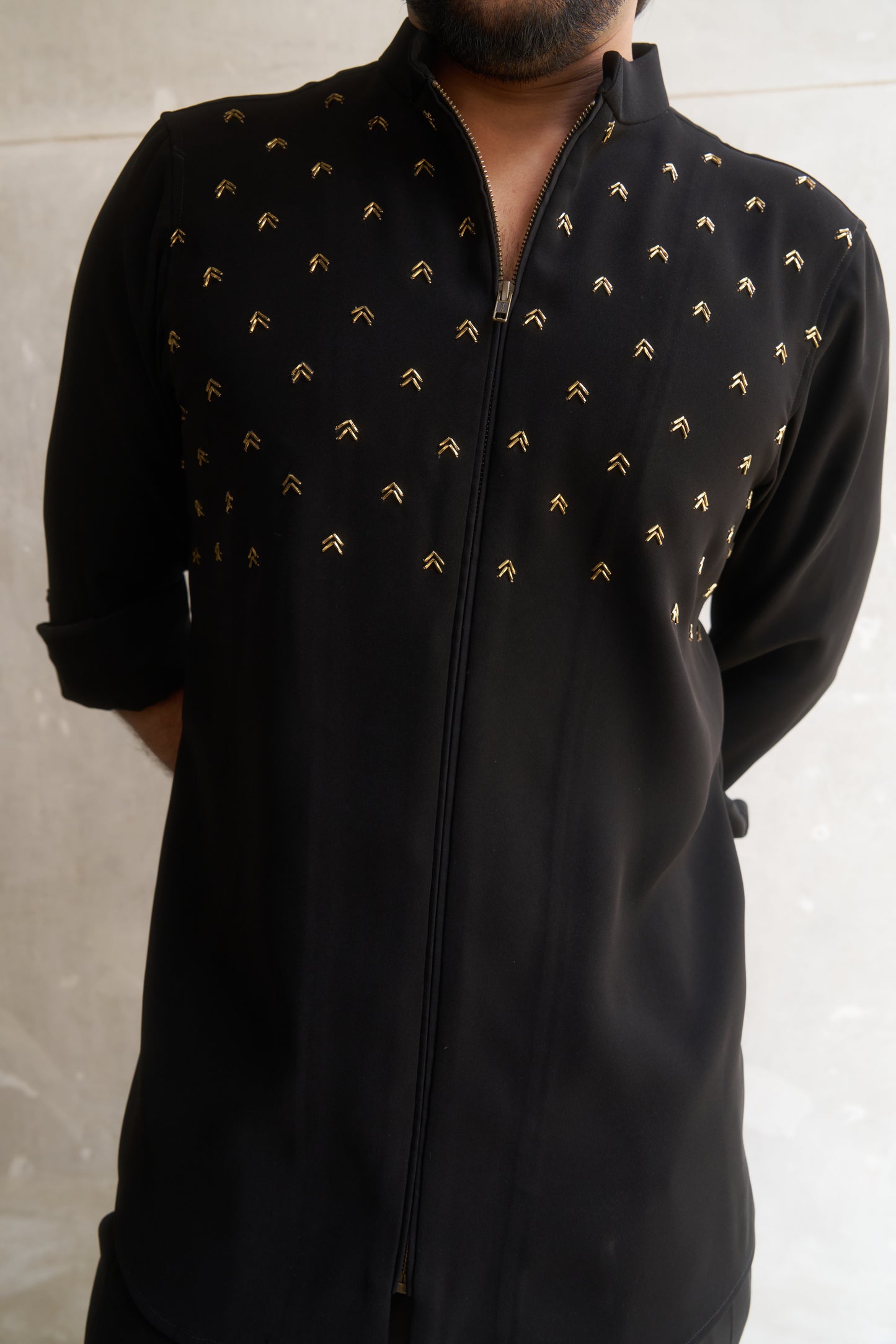 Black zipper shirt with gold arrow design