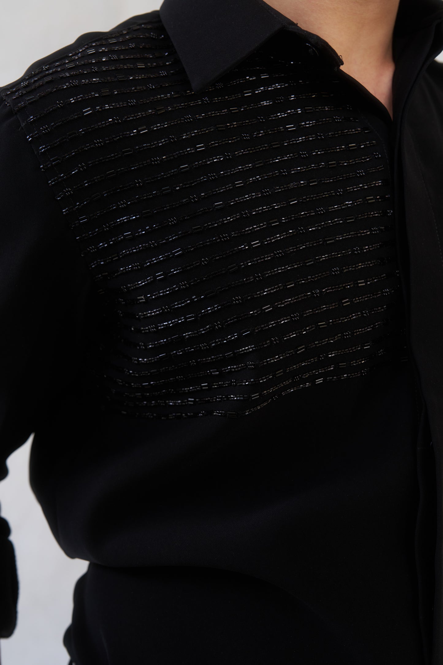 Black shirt with black embellishment design