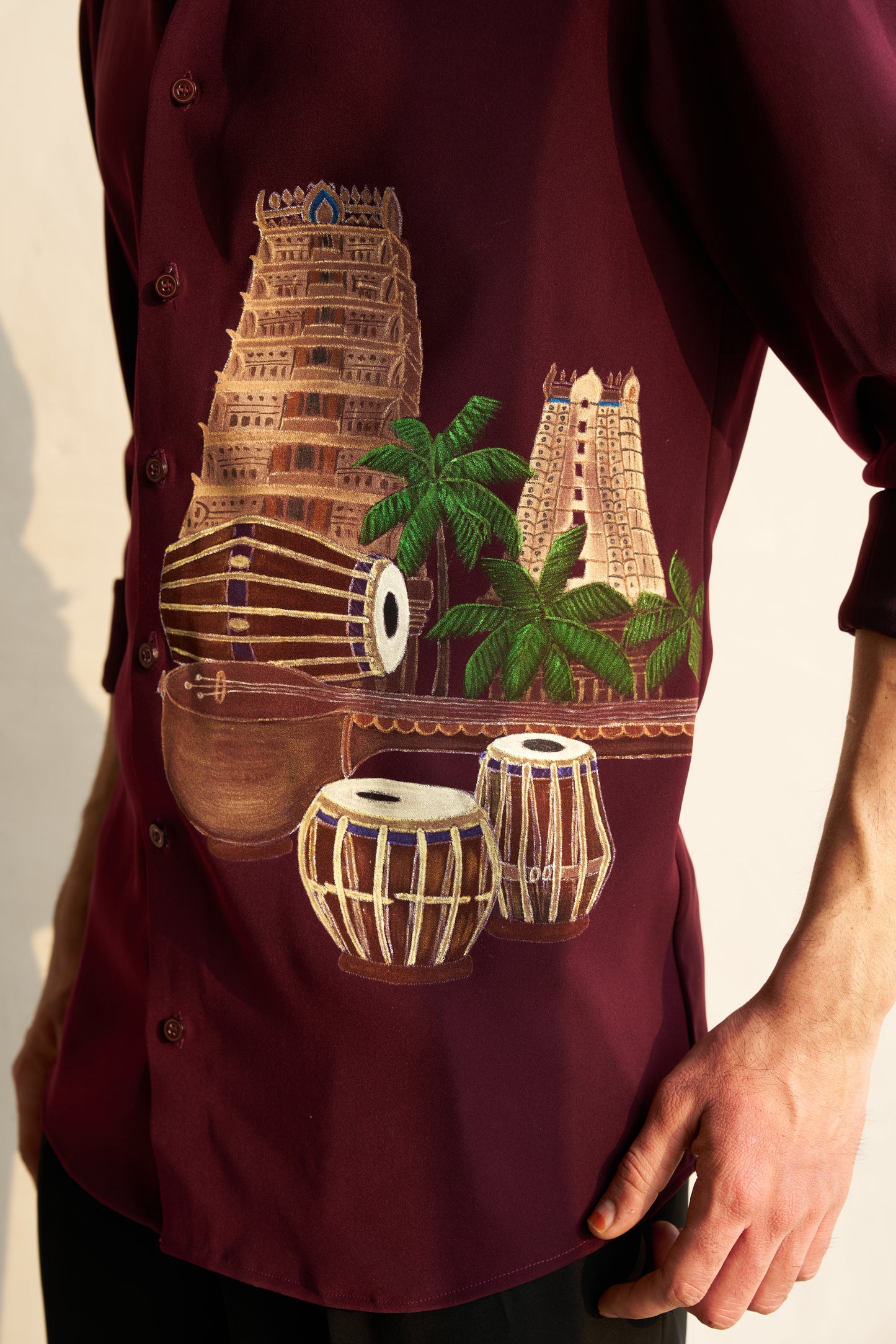 Burgundy shirt with Temple and musical instruments hand painted design