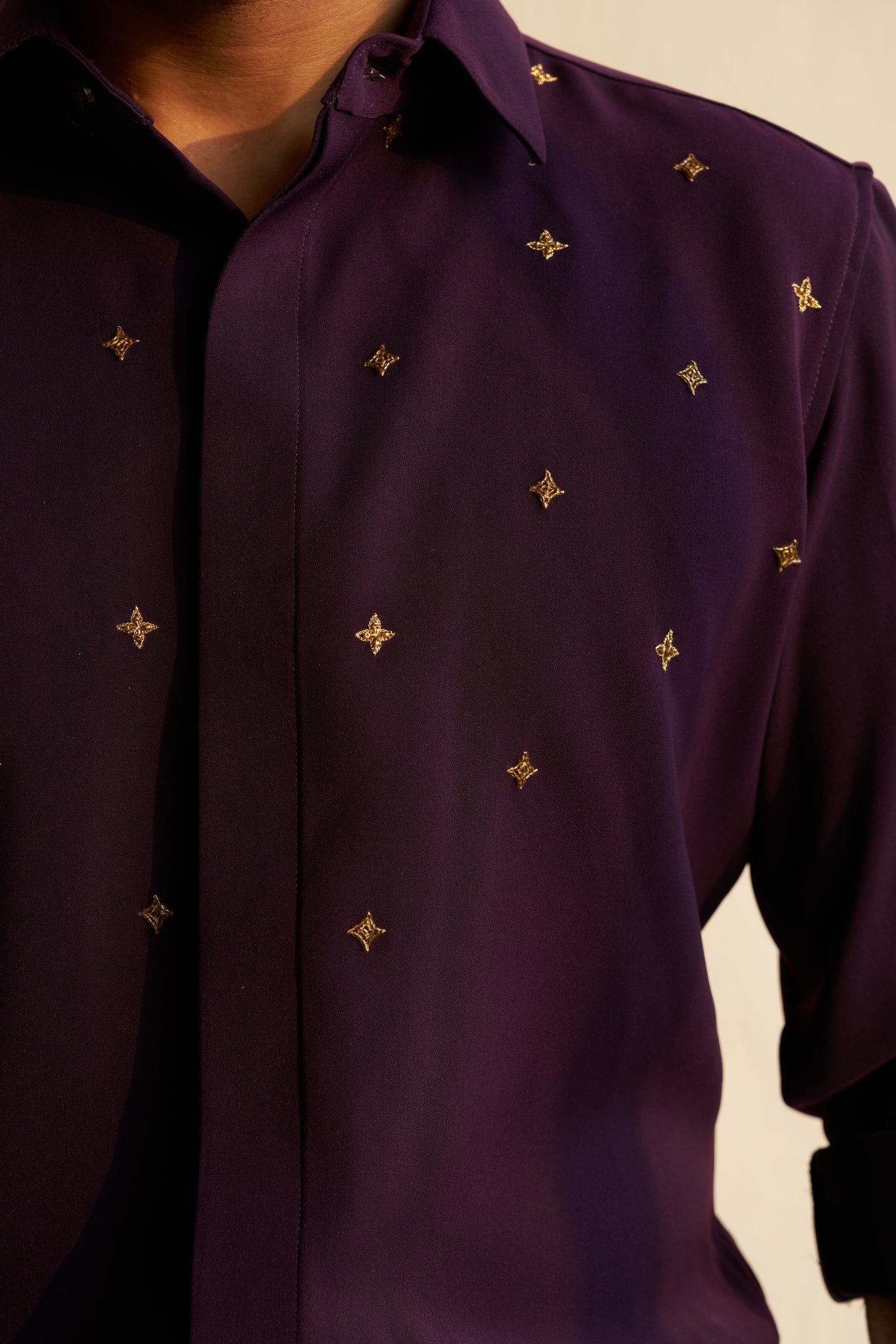 Dark Purple shirt with gold star shaped patterns design