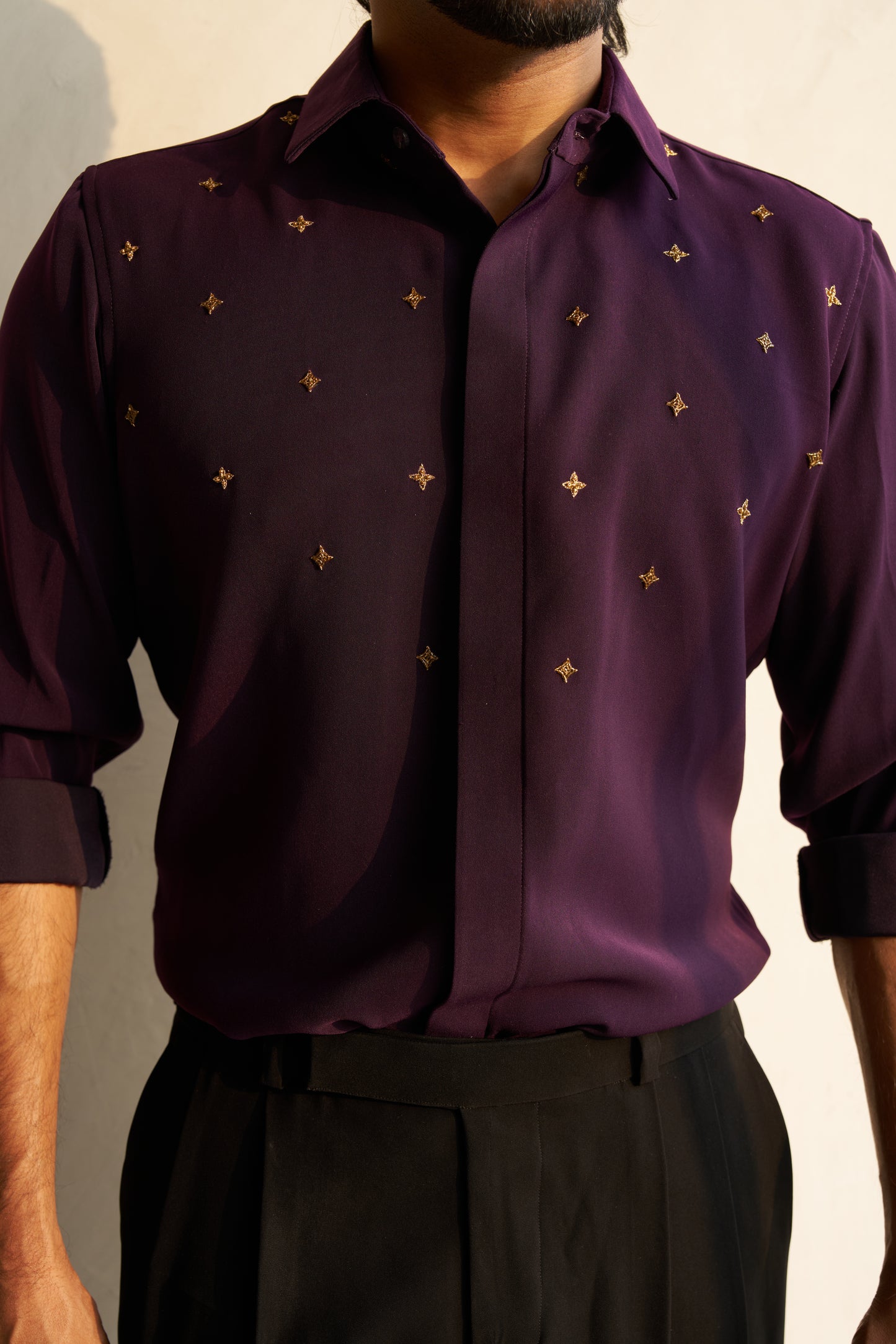 Dark Purple shirt with gold star shaped patterns design