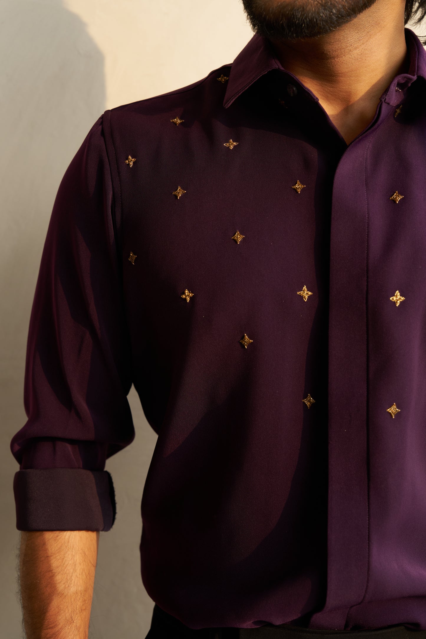Dark Purple shirt with gold star shaped patterns design