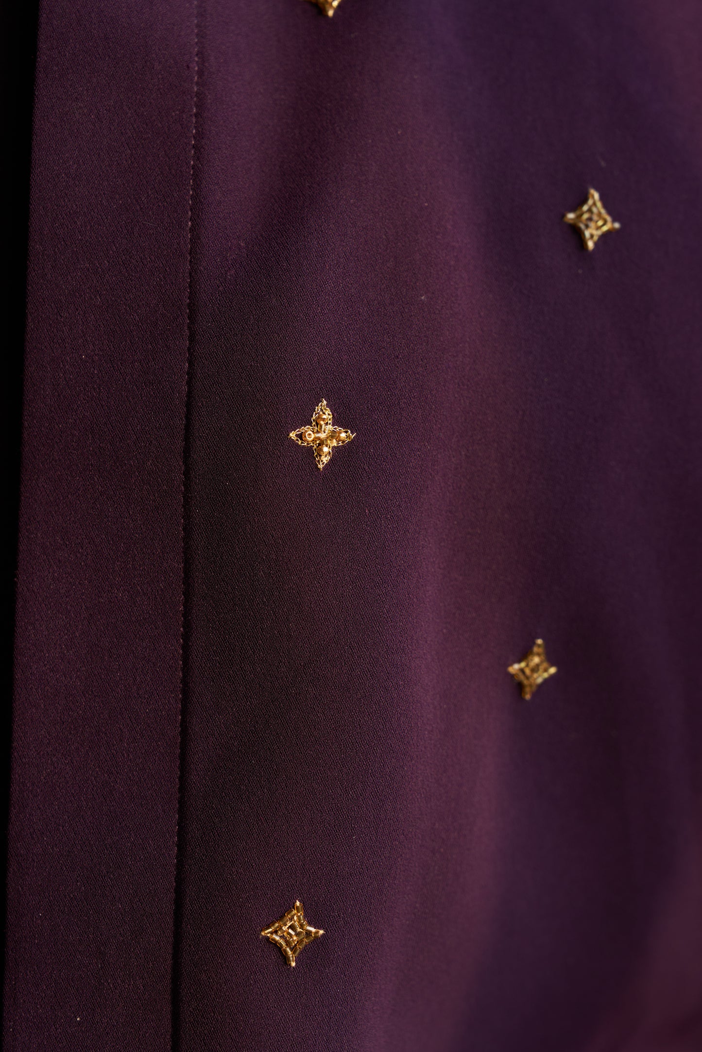 Dark Purple shirt with gold star shaped patterns design