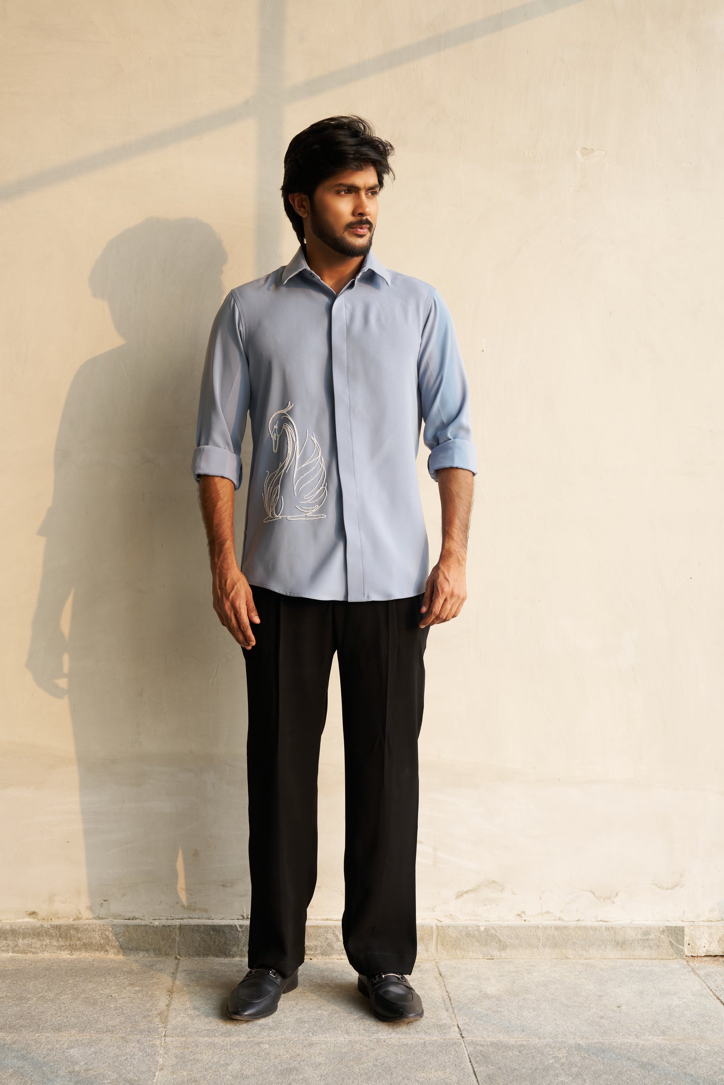 Light grey shirt with a white swan hand embroidery design