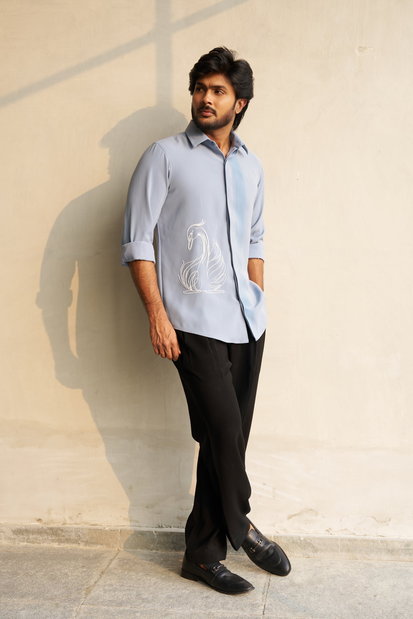 Light grey shirt with a white swan hand embroidery design