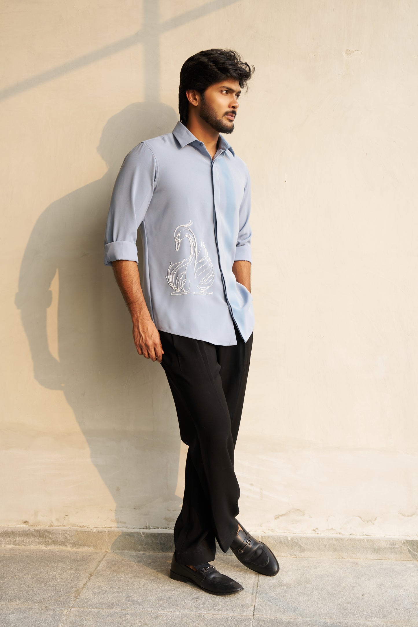 Light grey shirt with a white swan hand embroidery design