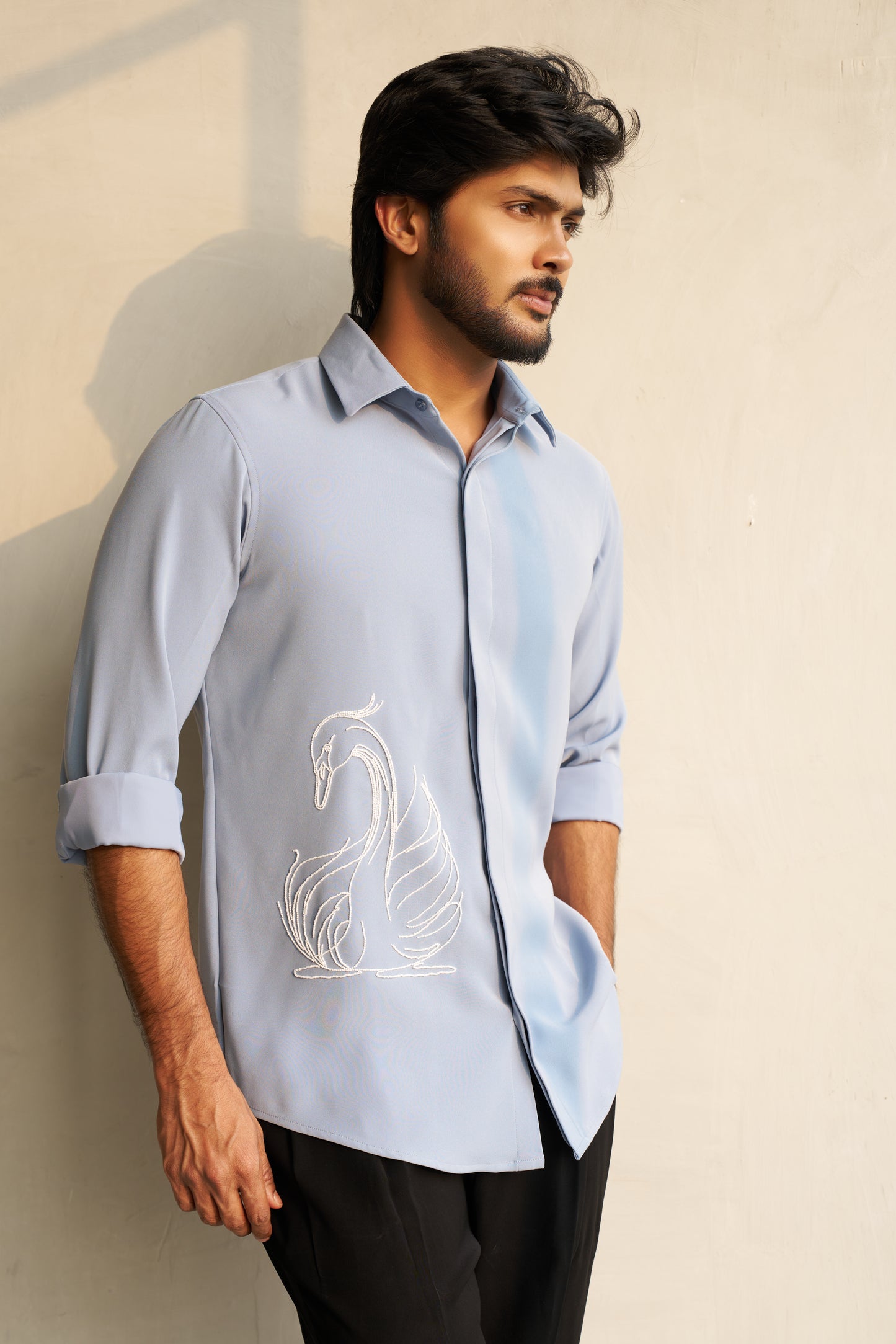 Light grey shirt with a white swan hand embroidery design