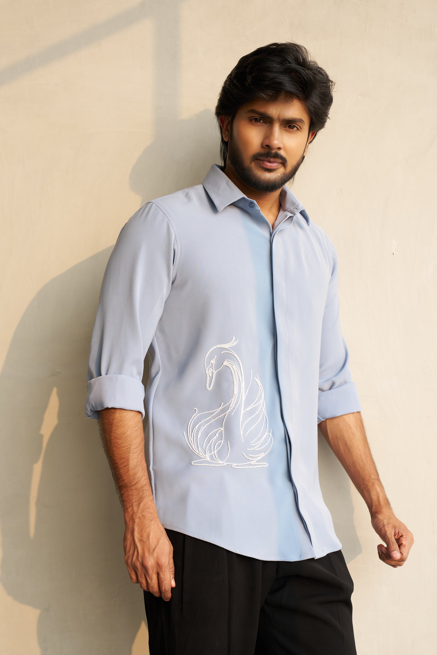 Light grey shirt with a white swan hand embroidery design