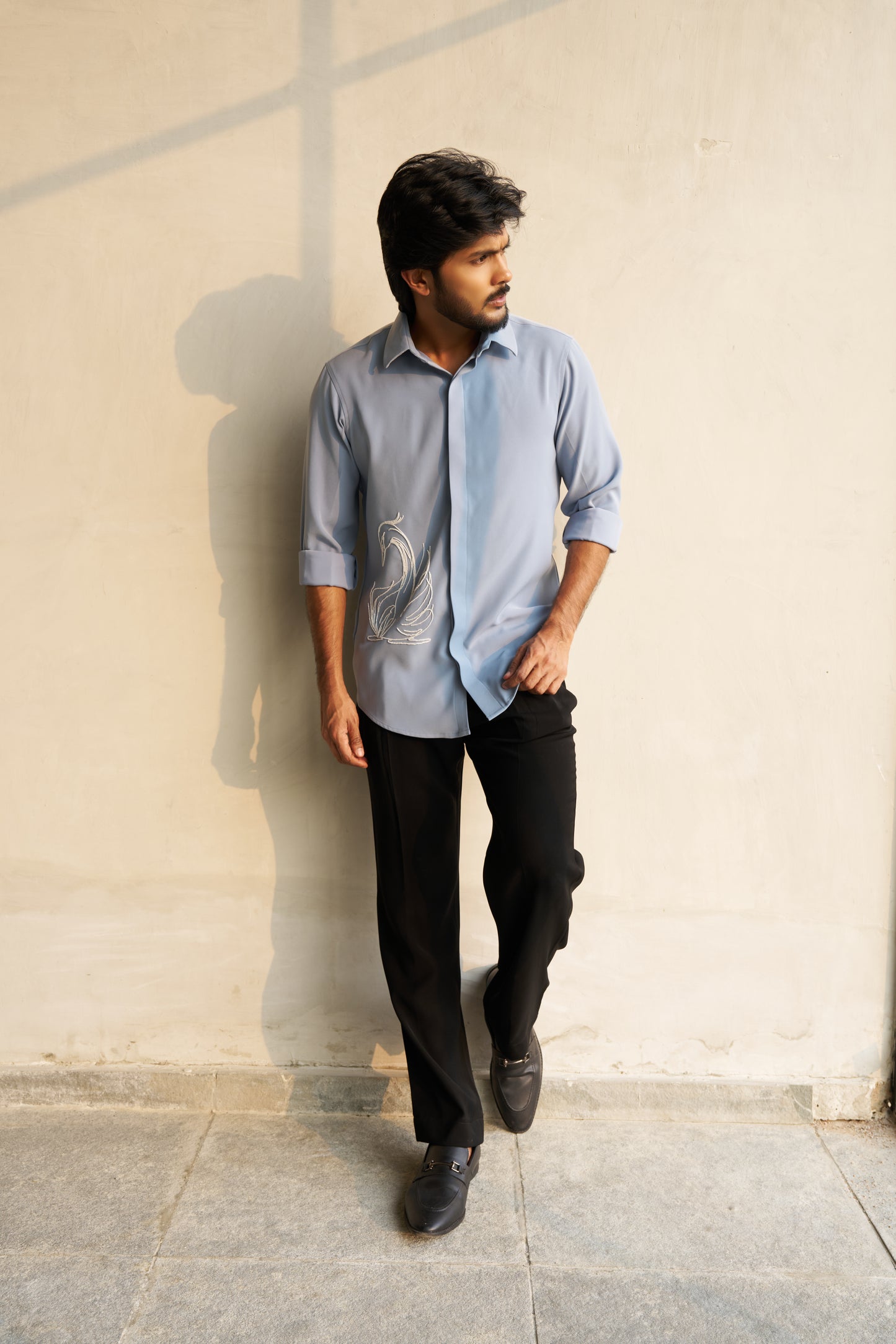 Light grey shirt with a white swan hand embroidery design