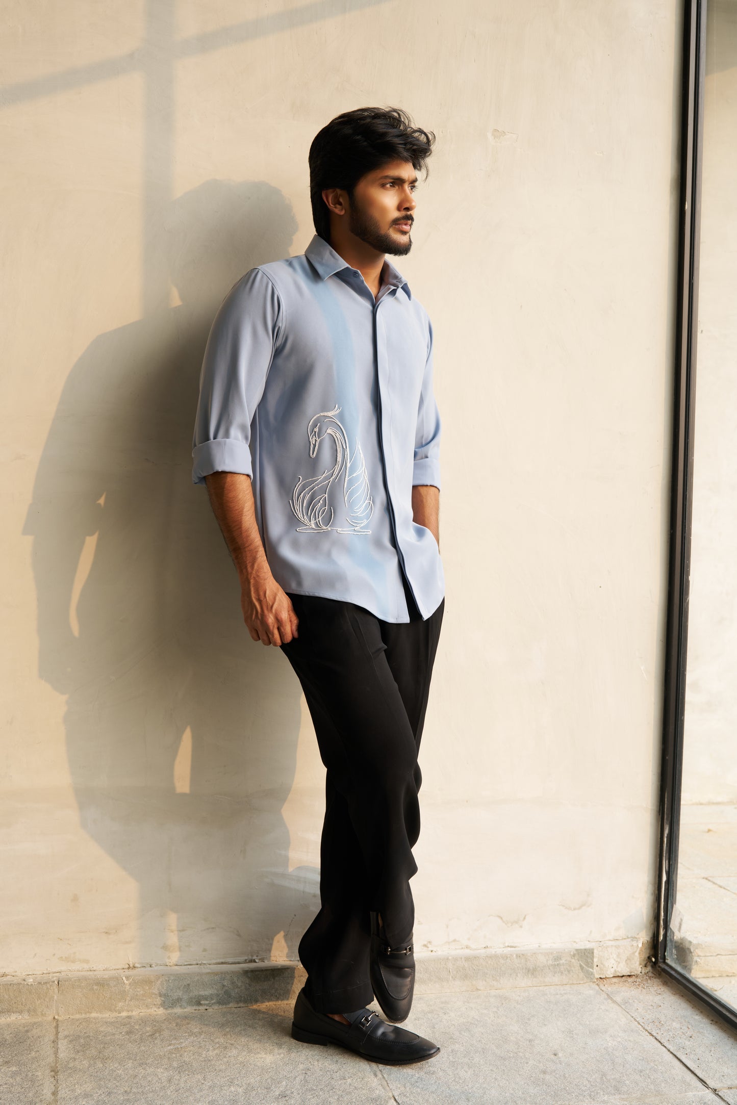 Light grey shirt with a white swan hand embroidery design