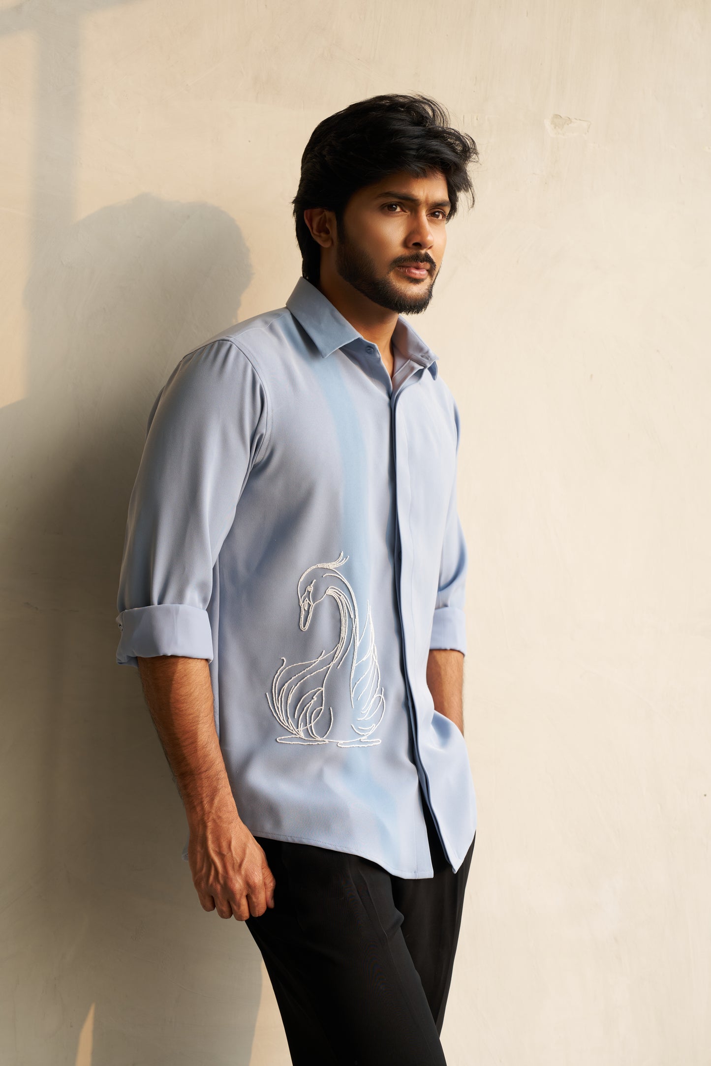 Light grey shirt with a white swan hand embroidery design