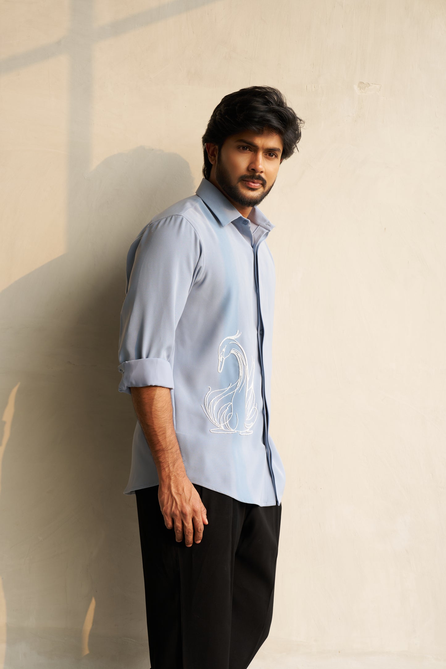 Light grey shirt with a white swan hand embroidery design