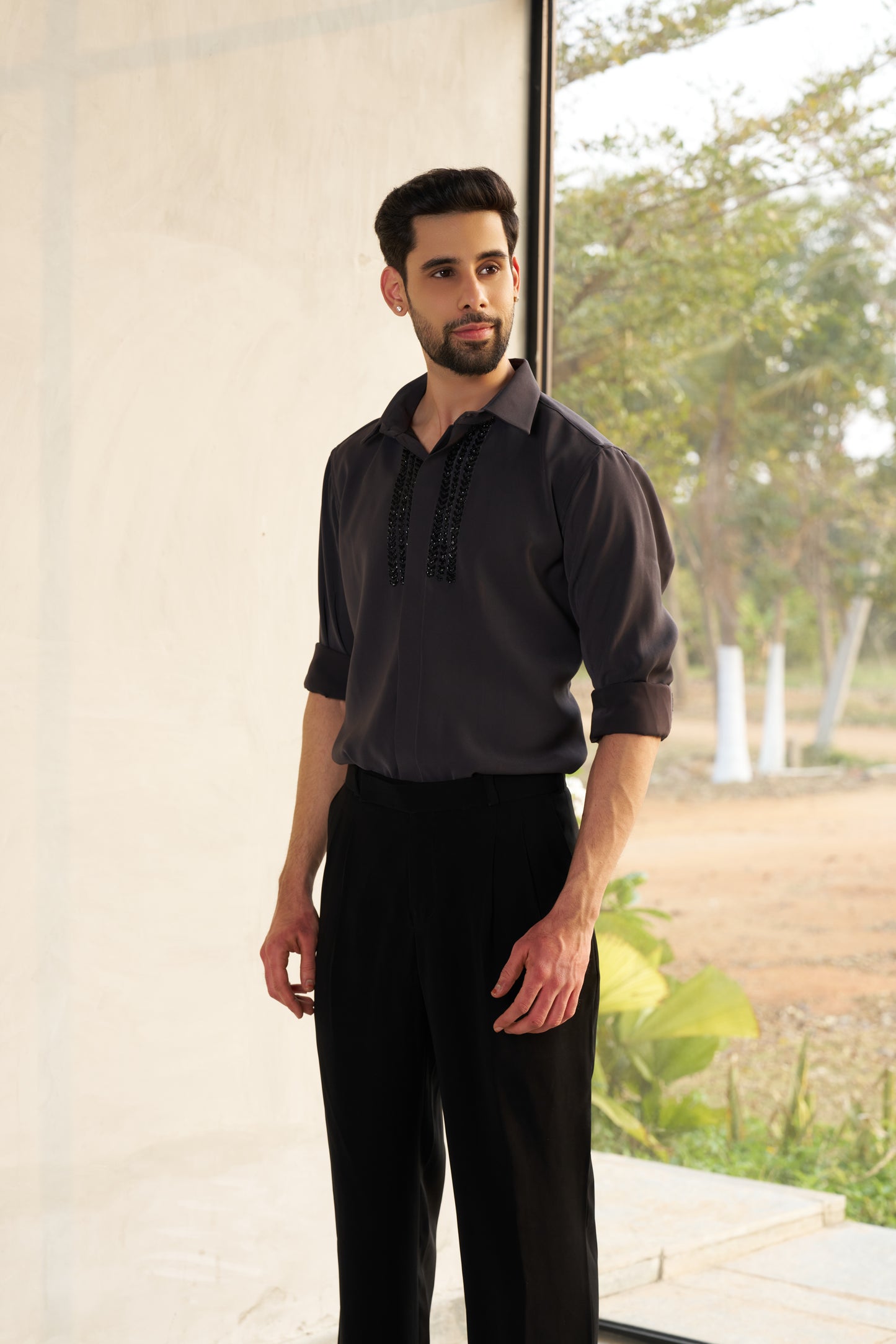 Dark grey shirt with black embellishment design