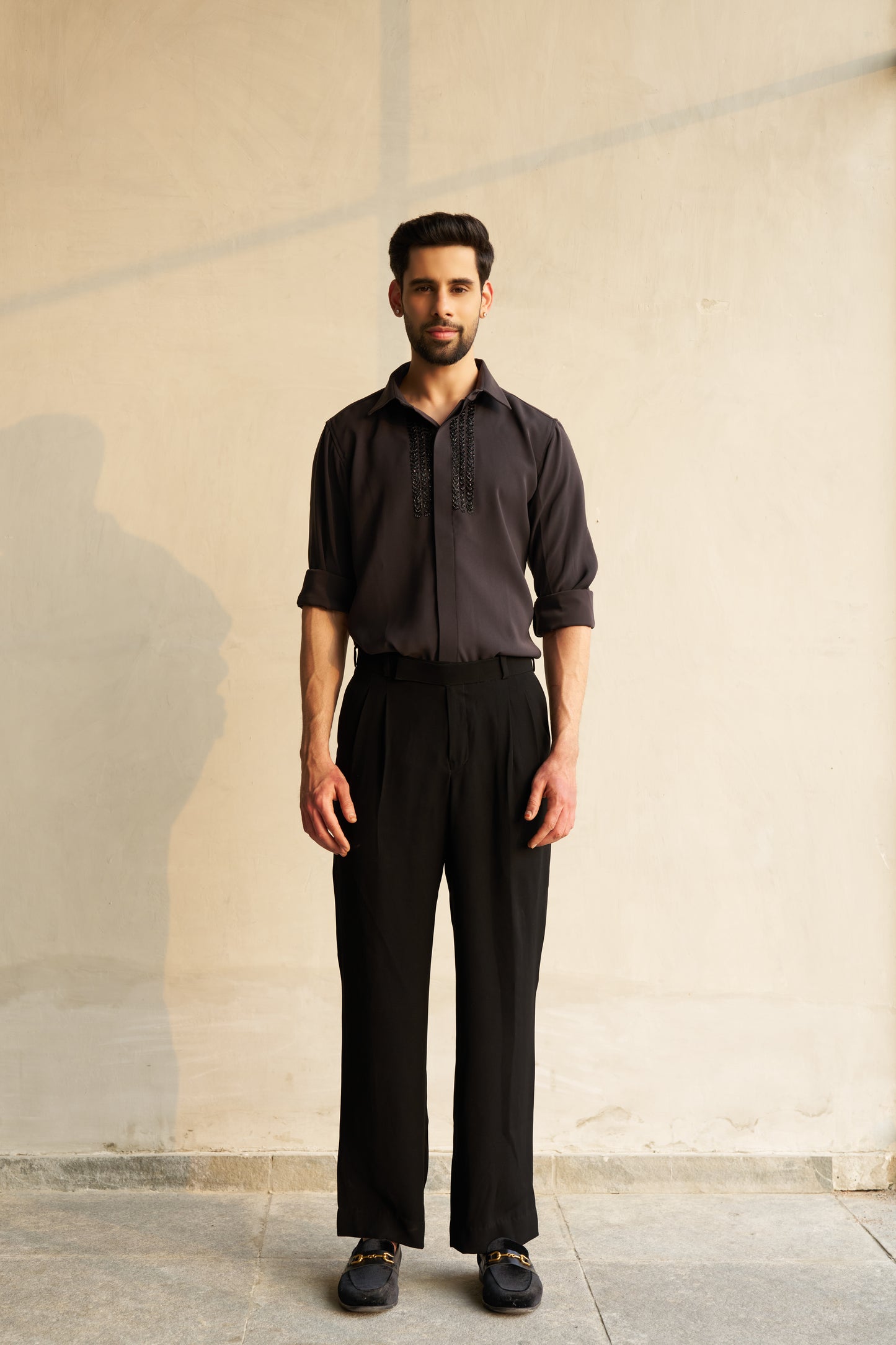 Dark grey shirt with black embellishment design