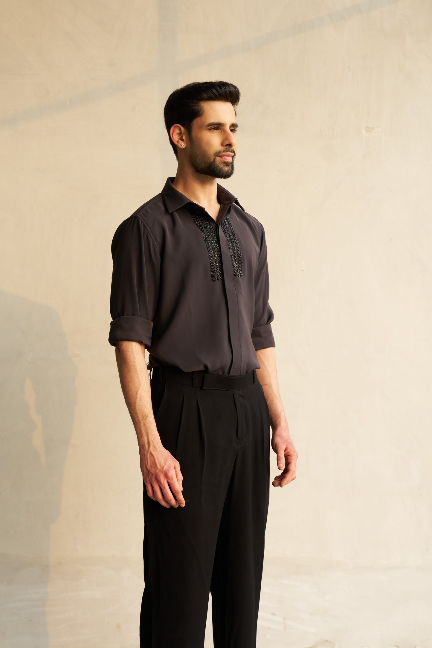Dark grey shirt with black embellishment design