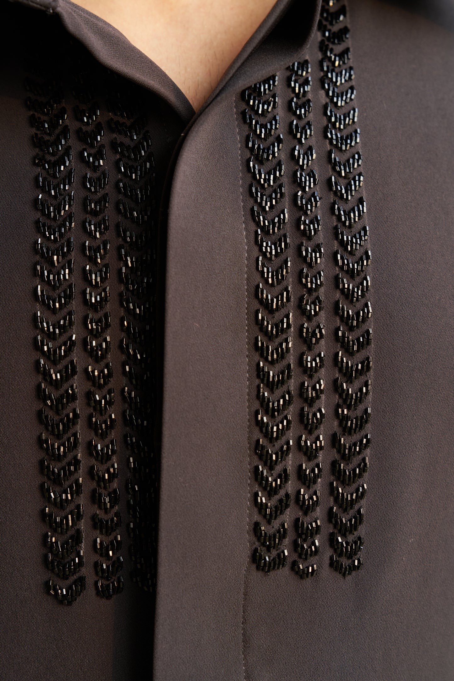 Dark grey shirt with black embellishment design