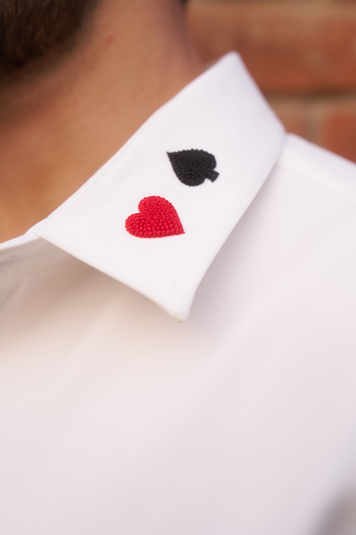 White shirt with playing cards thread embroidery design&nbsp;