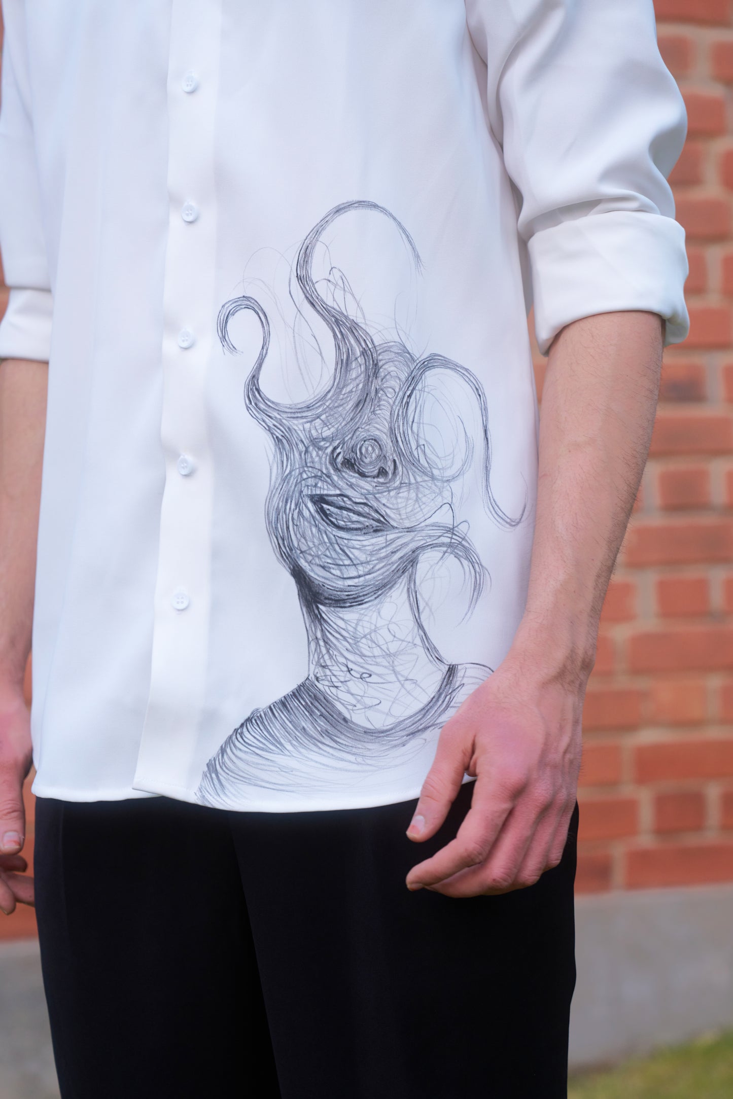 White shirt with face overwhelming hand painted design