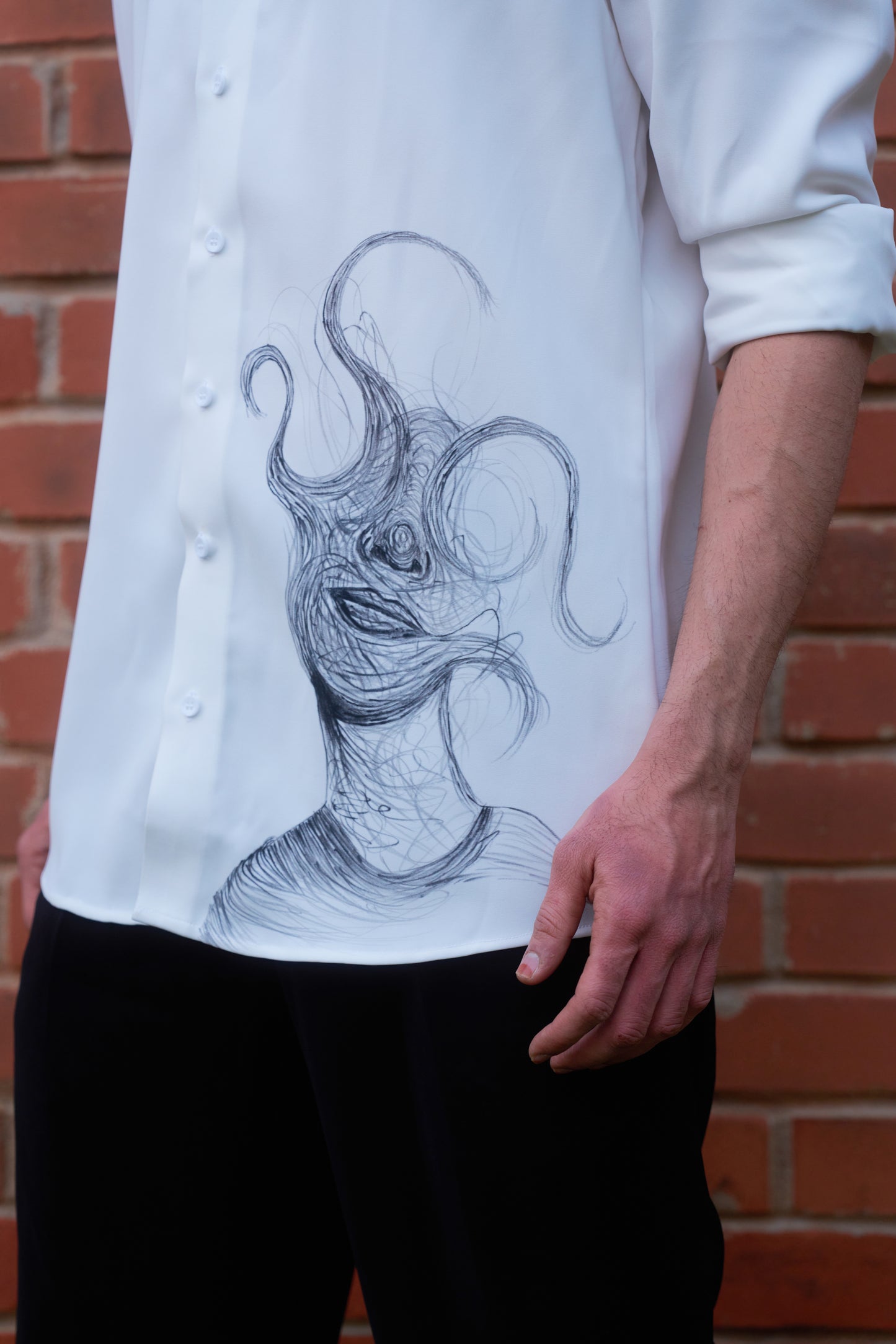 White shirt with face overwhelming hand painted design
