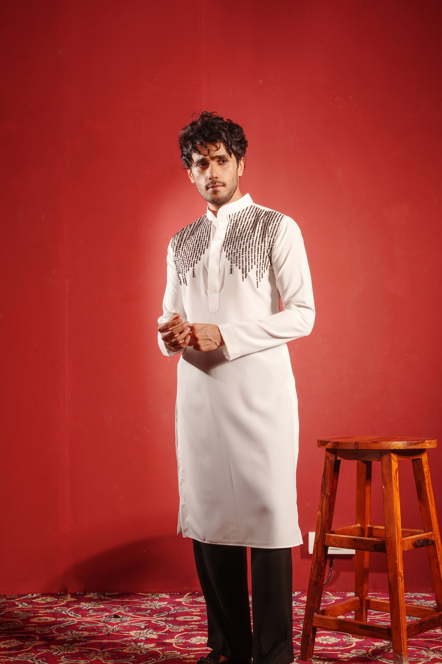White Kurta Embezzled with Black Motifs Design