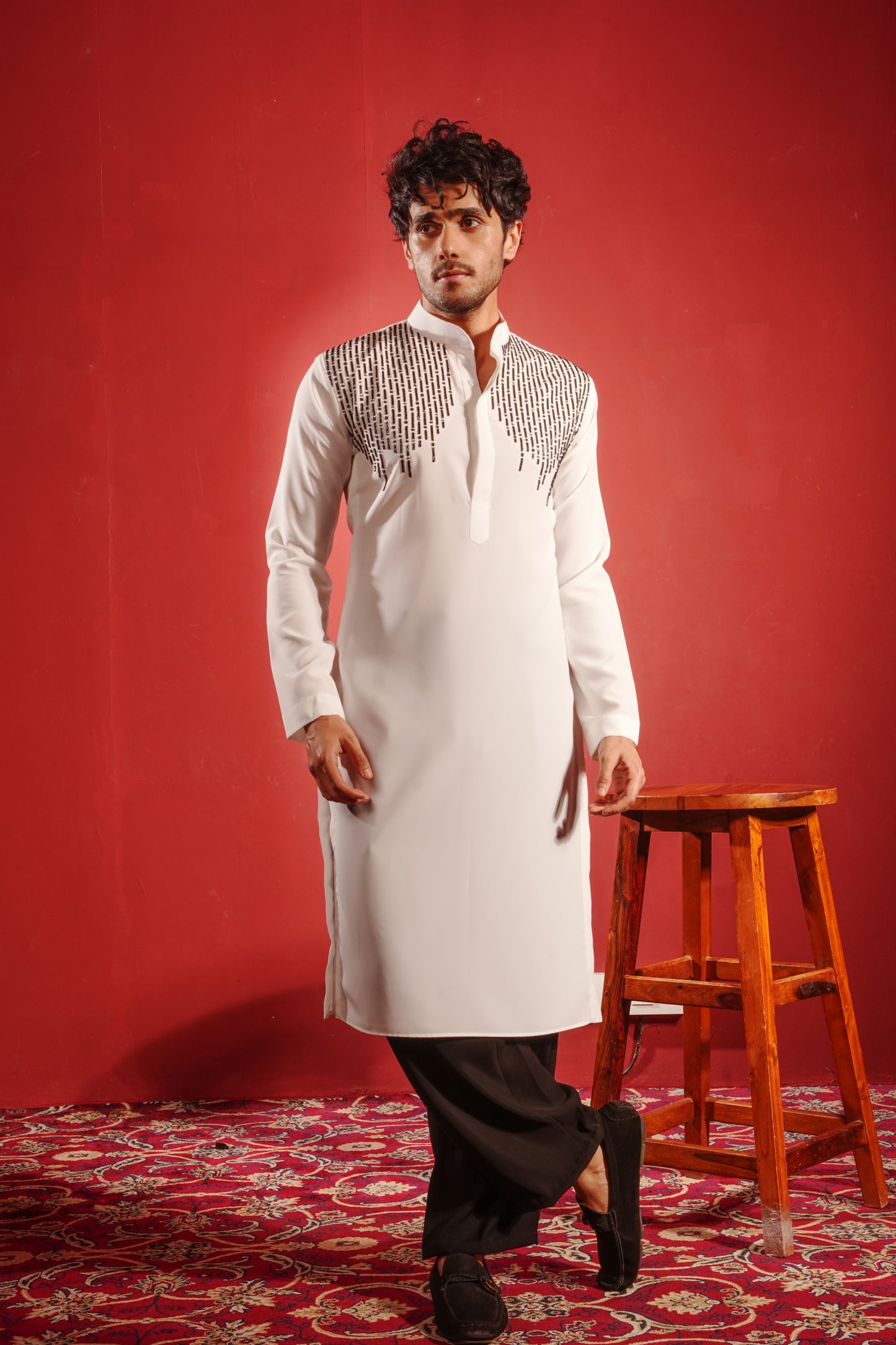 White Kurta Embezzled with Black Motifs Design