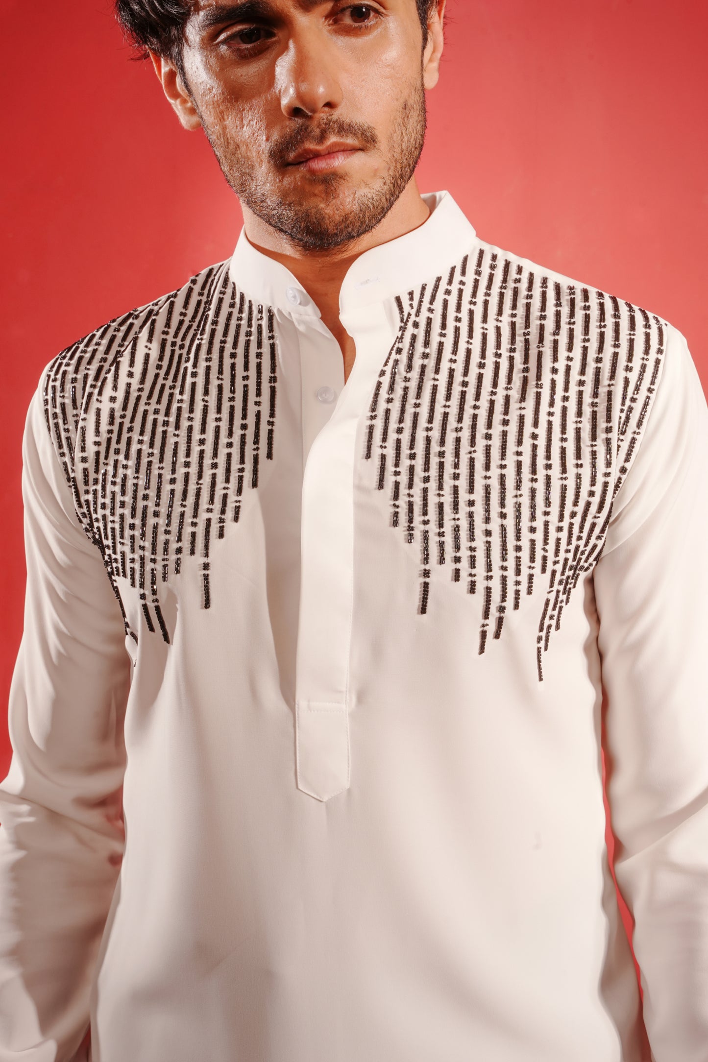 White Kurta Embezzled with Black Motifs Design